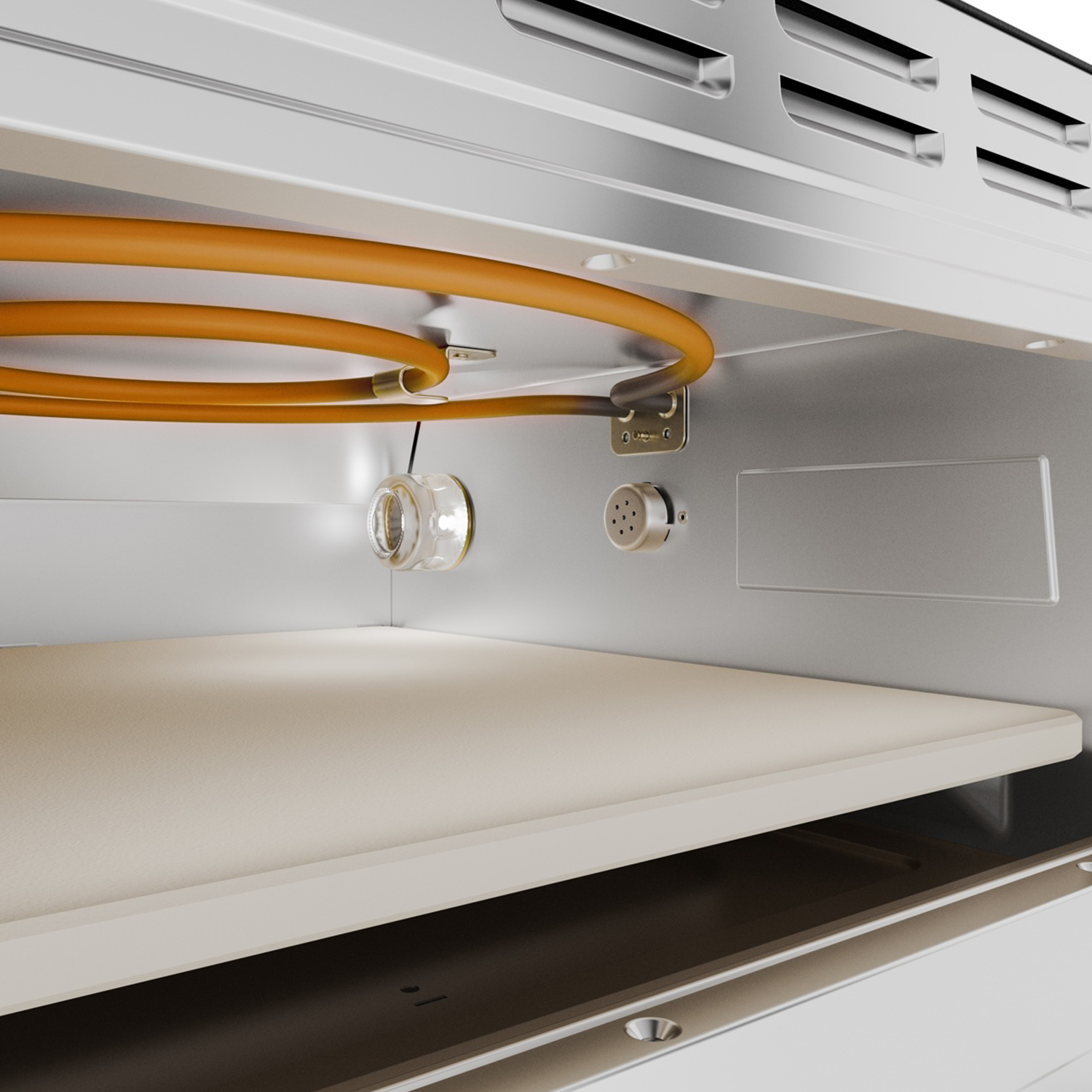 Interno di un forno, con ripiano beige, tubo del gas arancione, componente in vetro ed elementi metallici.