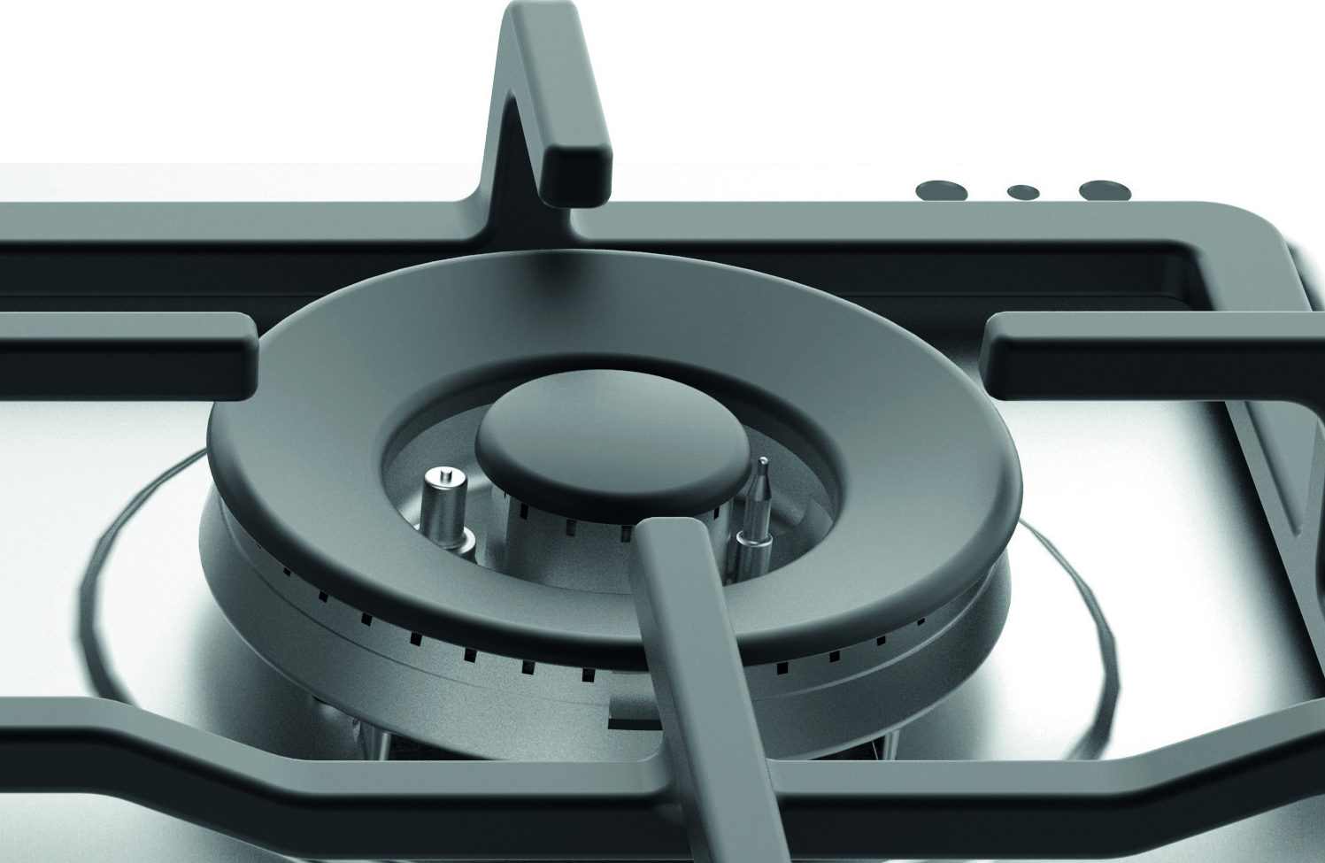 Zbliżenie palnika kuchenki gazowej. Ciemnoszary palnik znajduje się na powierzchni ze stali nierdzewnej. Palnik posiada centralną nasadkę i podpory.