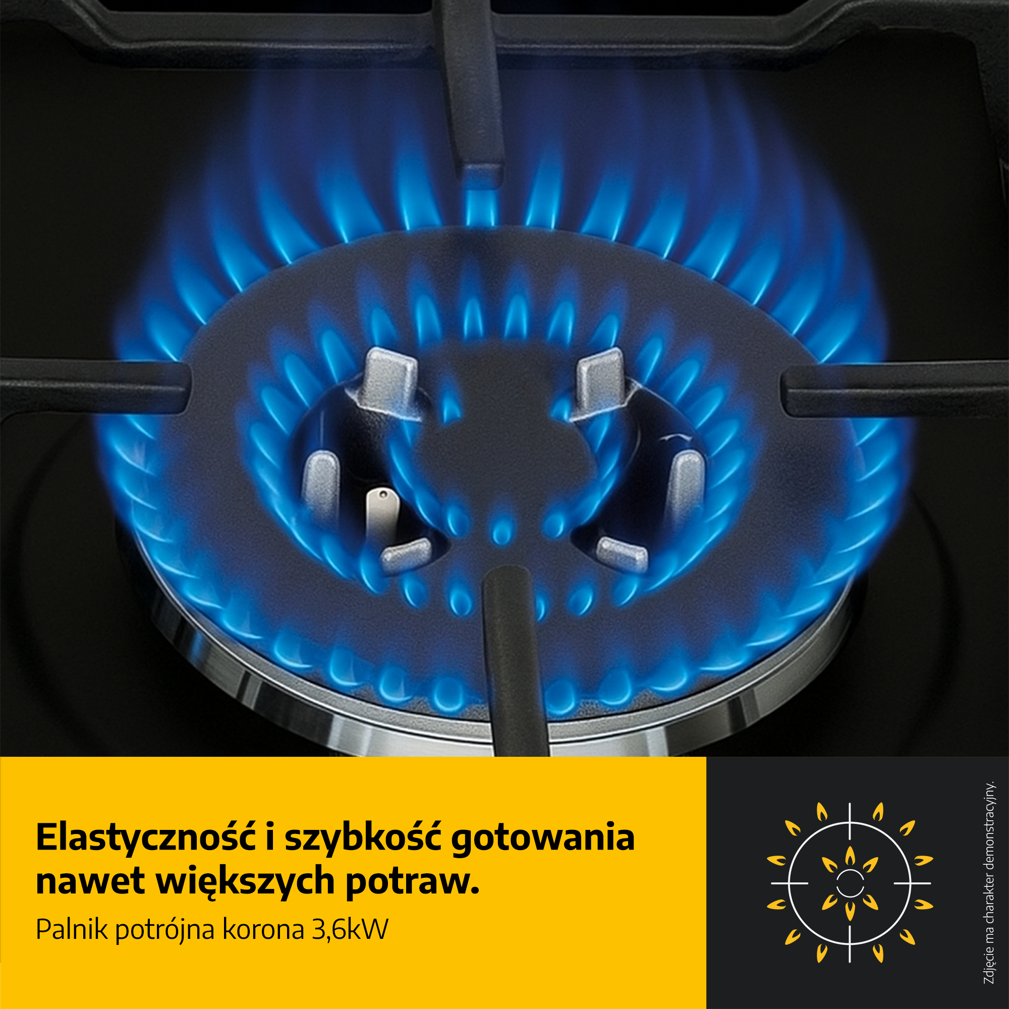 Zbliżenie palnika kuchenki gazowej z niebieskimi płomieniami. Palnik jest czarny ze srebrnymi akcentami.