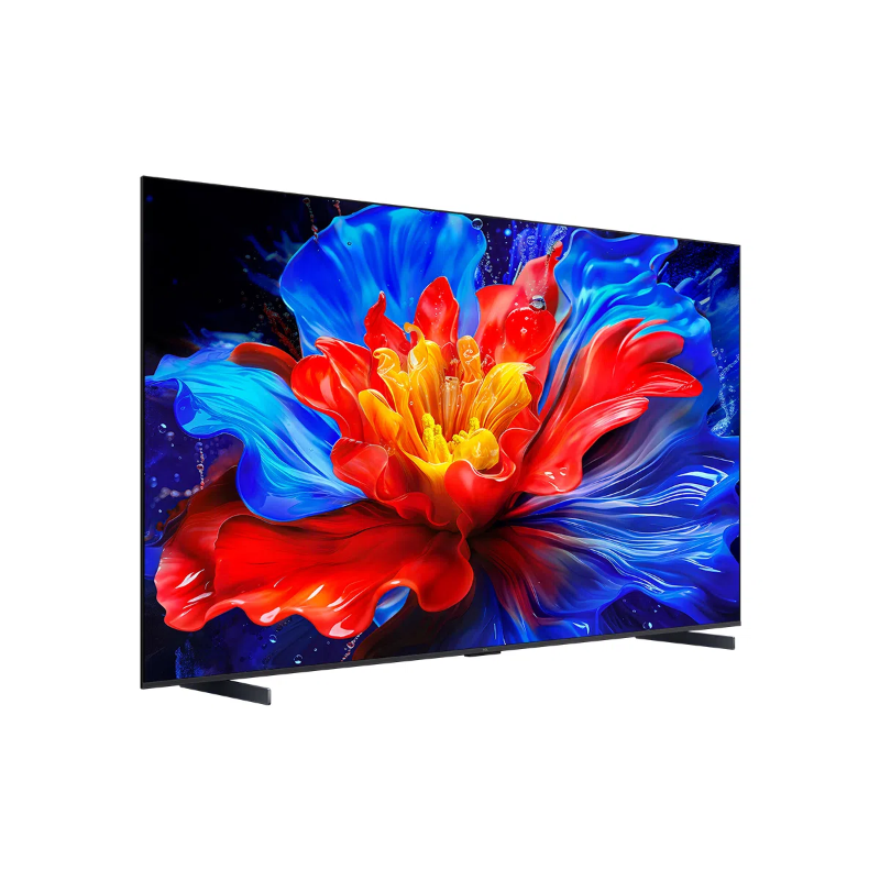 Bir TV ekranı canlı bir çiçek görüntüsü görüntülüyor. Çiçeğin kırmızı, sarı ve mavi yaprakları var. TV'nin siyah çerçevesi ve standı var.