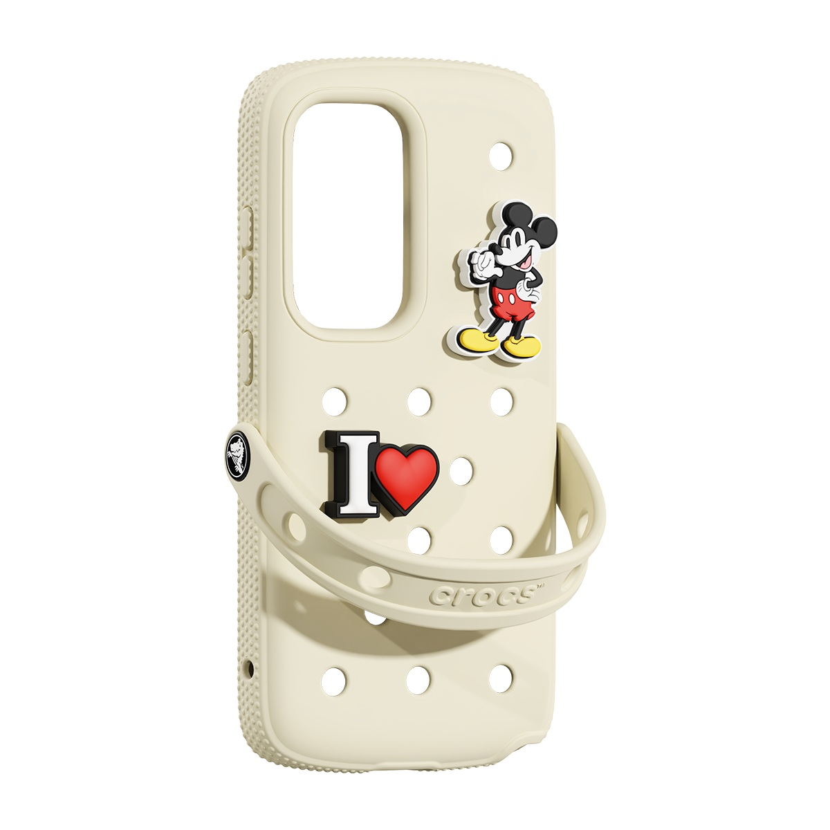 Mickey Mouse, 'I heart' ve Crocs logolarıyla süslenmiş, Croc şeklinde krem renkli bir telefon kılıfı.