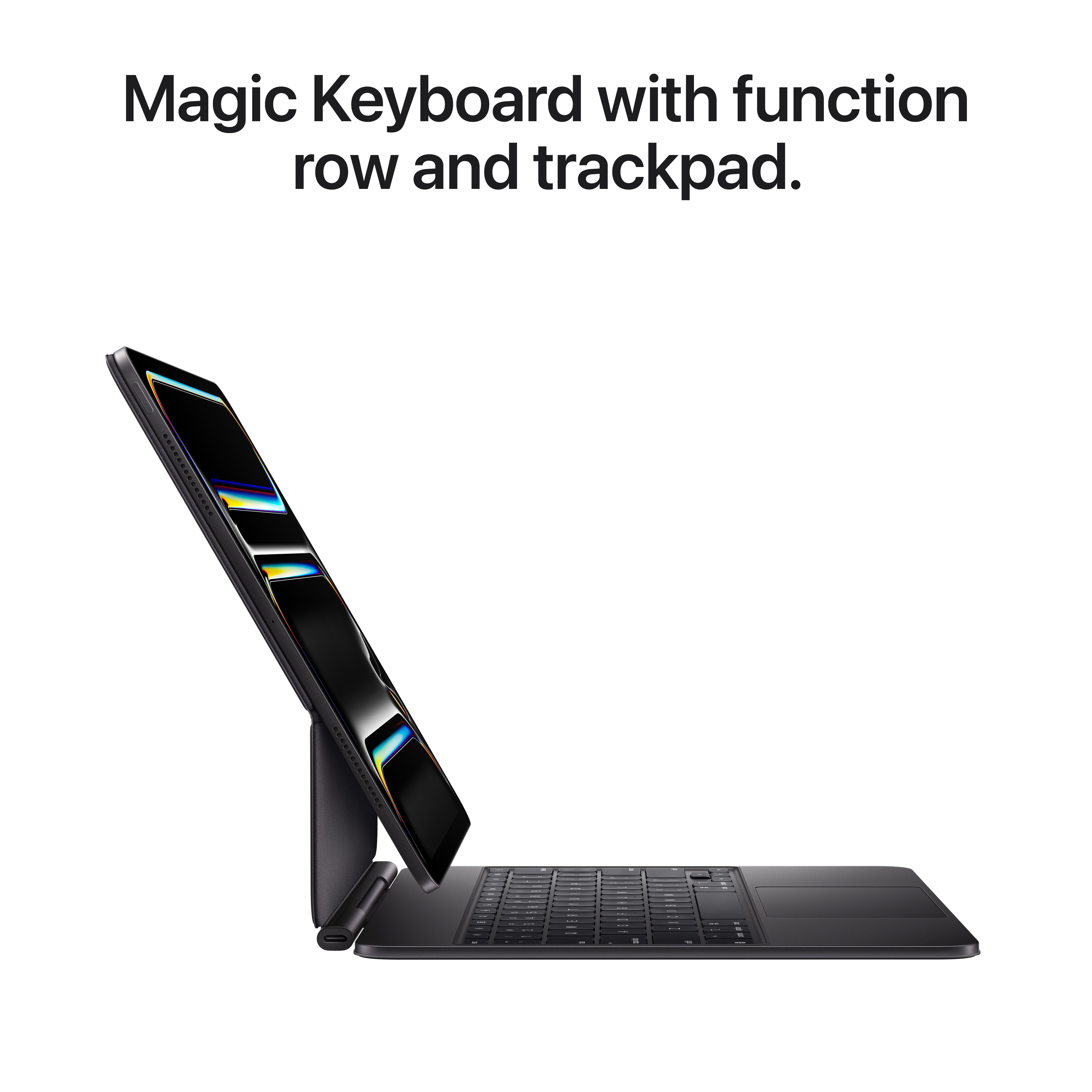 Schwarze Magic Keyboard mit iPad. Tastatur hat Funktionsleiste und Trackpad. iPad ist schwarz mit hellem Bildschirm.