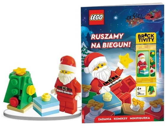 Scena świąteczna Lego: figurka Świętego Mikołaja, zielone drzewko, prezenty i okładka książki ze Świętym Mikołajem i saniami.