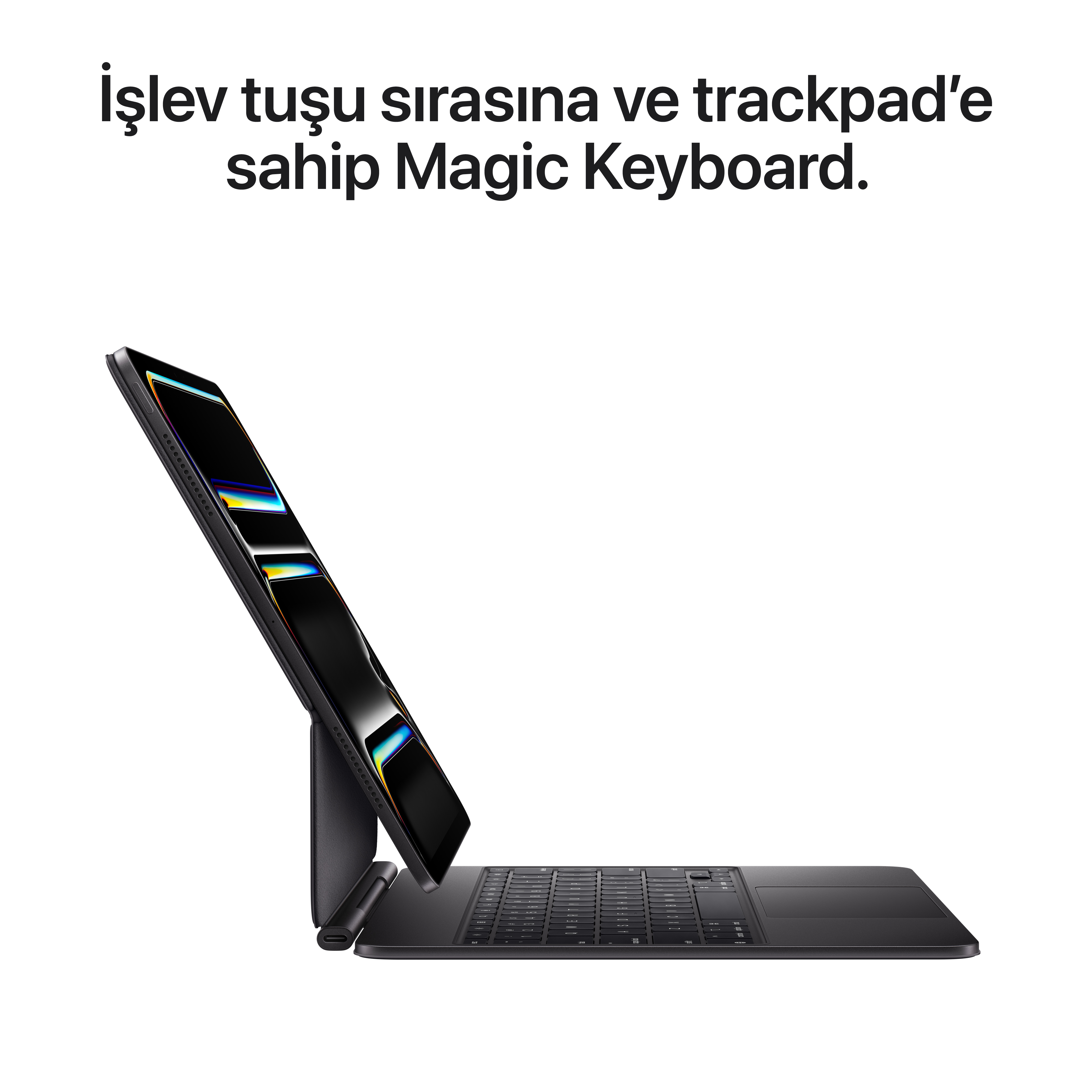 iPad'li siyah Magic Keyboard. Klavyede bir izleme dörtgeni var. iPad eğik ve renkli bir ekran gösteriyor.
