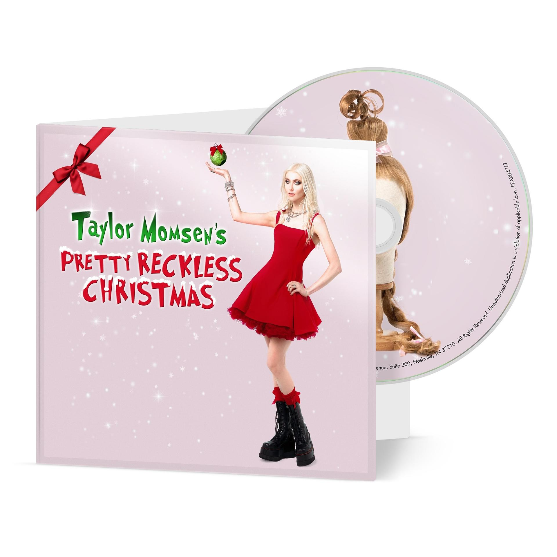 Albumcover: Taylor Momsen in rotem Kleid, hält Ornament. CD rechts. Rosa Hintergrund, Schneeflocken und Text: Pretty Reckless Christmas.