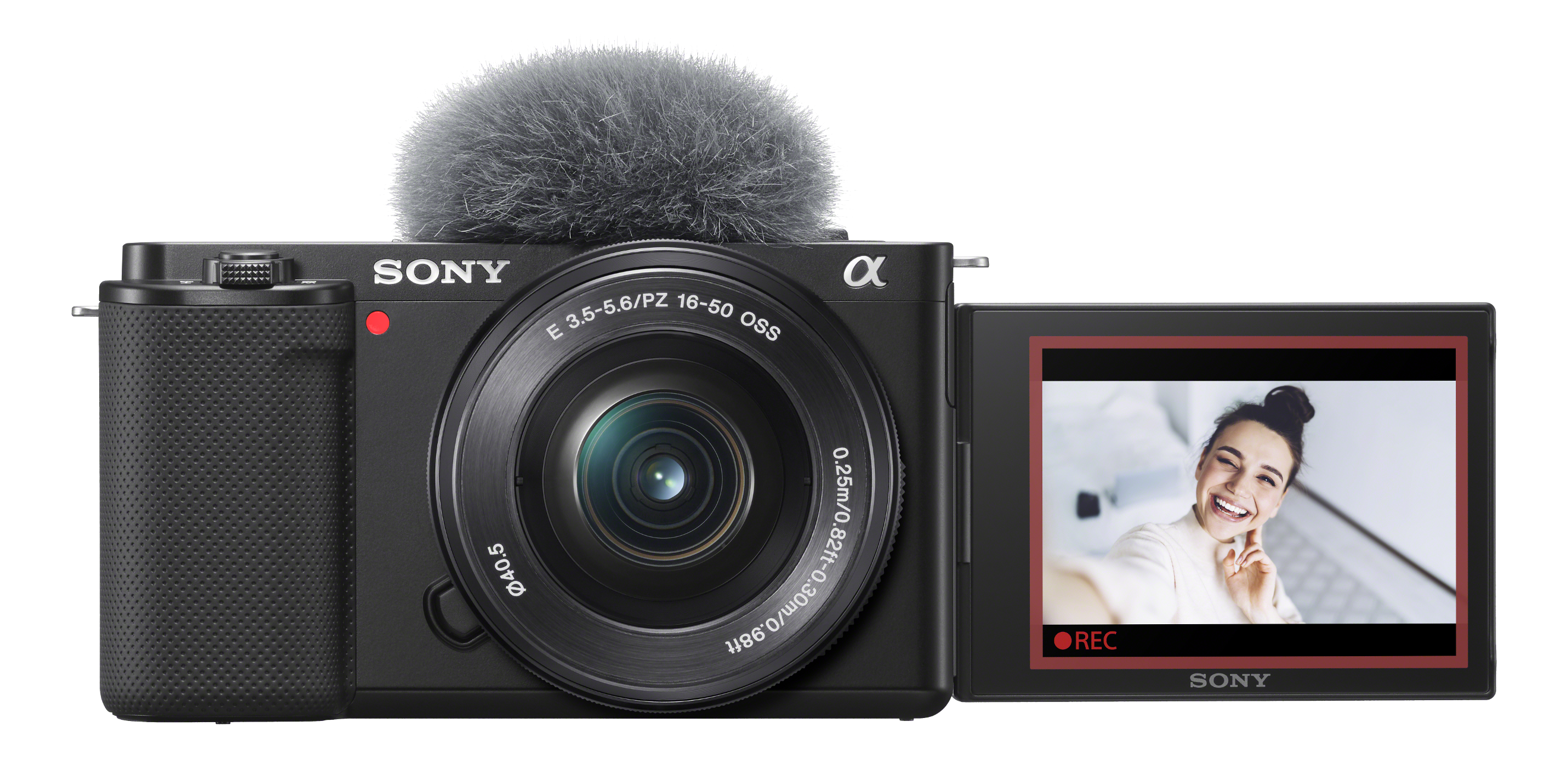 Eine schwarze Sony-Kamera mit Mikrofon und Bildschirm, der eine lächelnde Frau zeigt. Der Bildschirm ist rot umrandet.