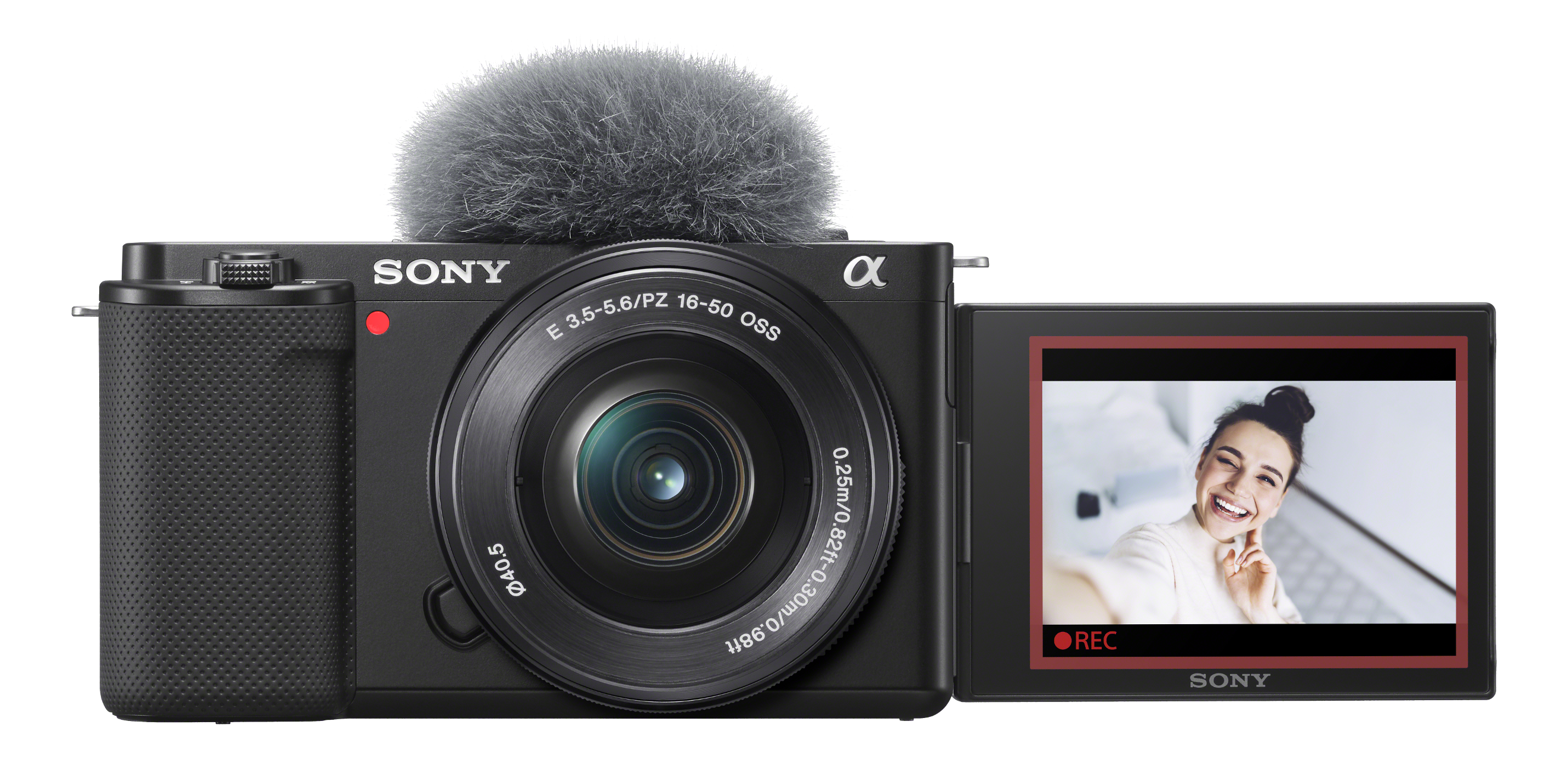 Eine schwarze Sony-Kamera mit Mikrofon. Der Bildschirm zeigt eine lächelnde Frau. Die Kamera zeichnet auf.