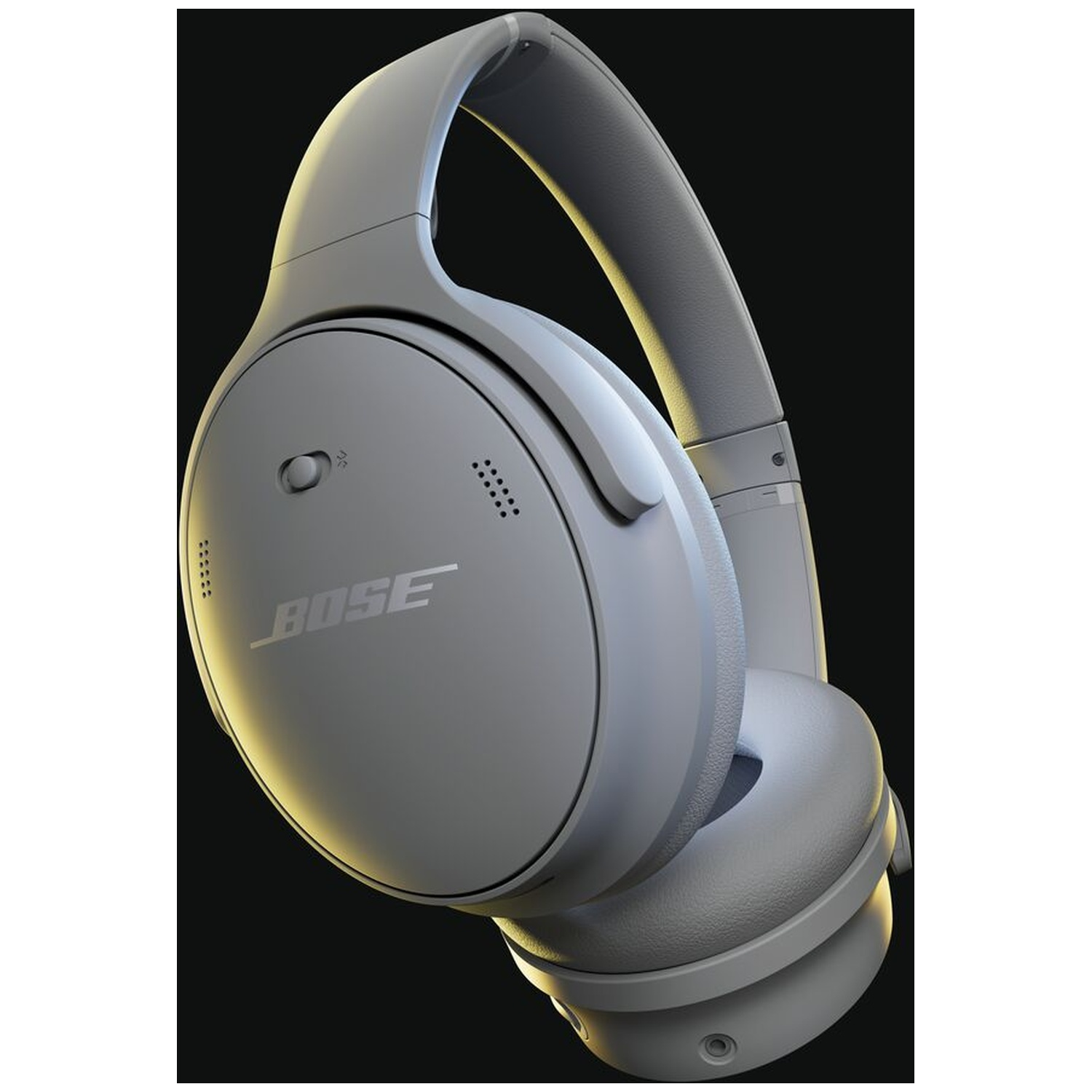 Gray Bose headphones on a black background. The headphones are angled, showing the earcups and headband. Bose logo is visible.
