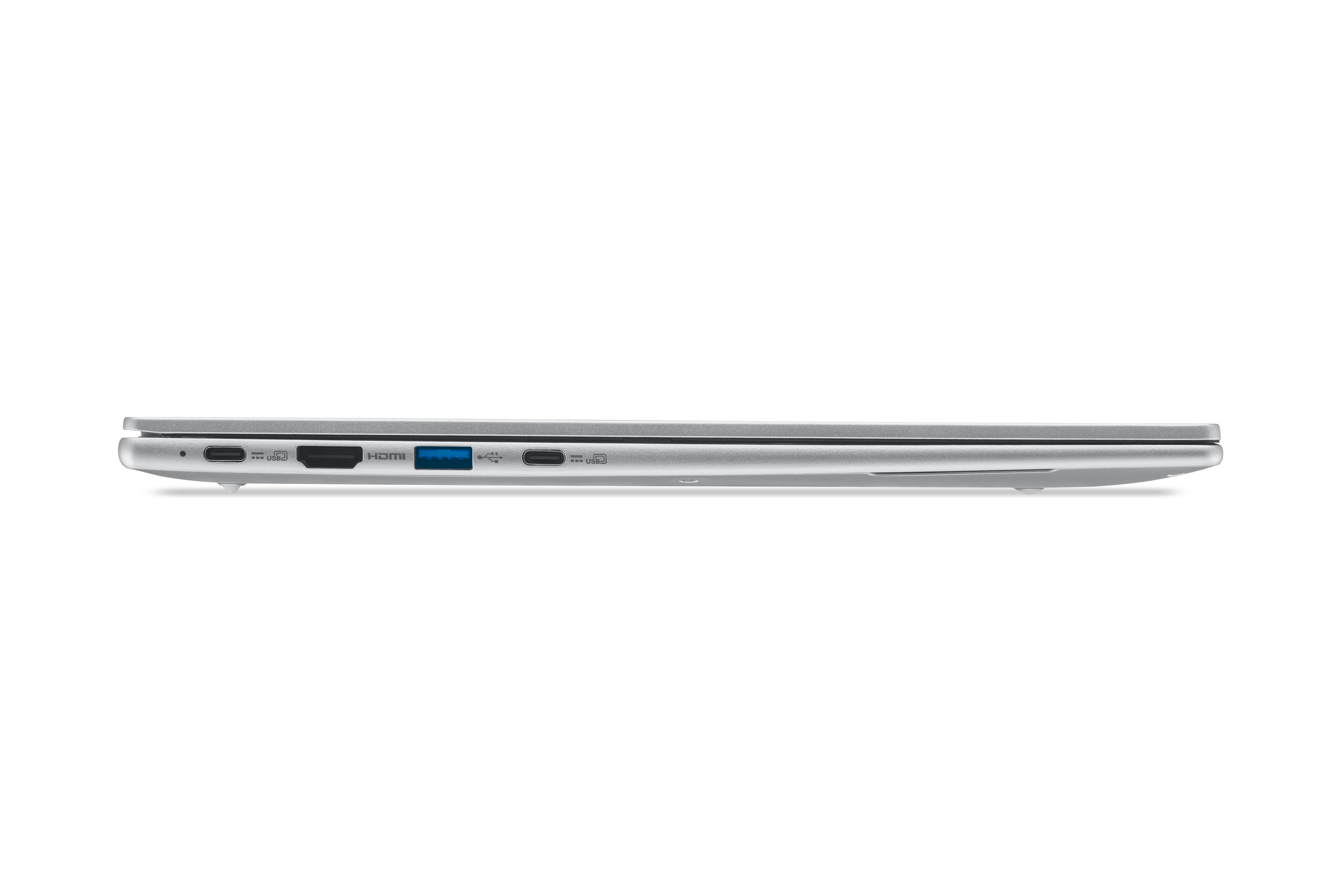 Seitenansicht eines silbernen Laptops. Sichtbare Anschlüsse sind USB, HDMI und Strom. Der Laptop steht vor weißem Hintergrund.