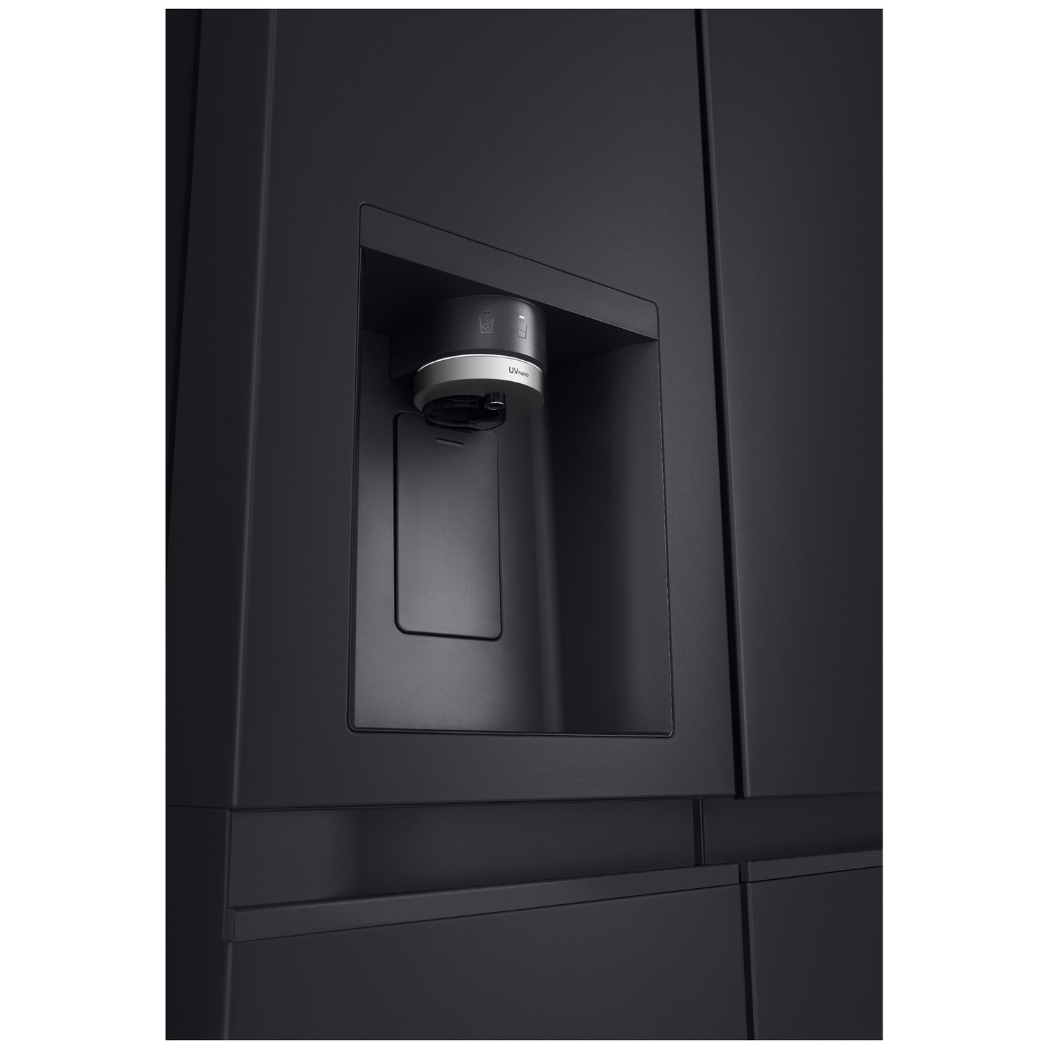 Close-up of a black refrigerator with a dispenser. A silver and black dispenser is set in a recessed area.