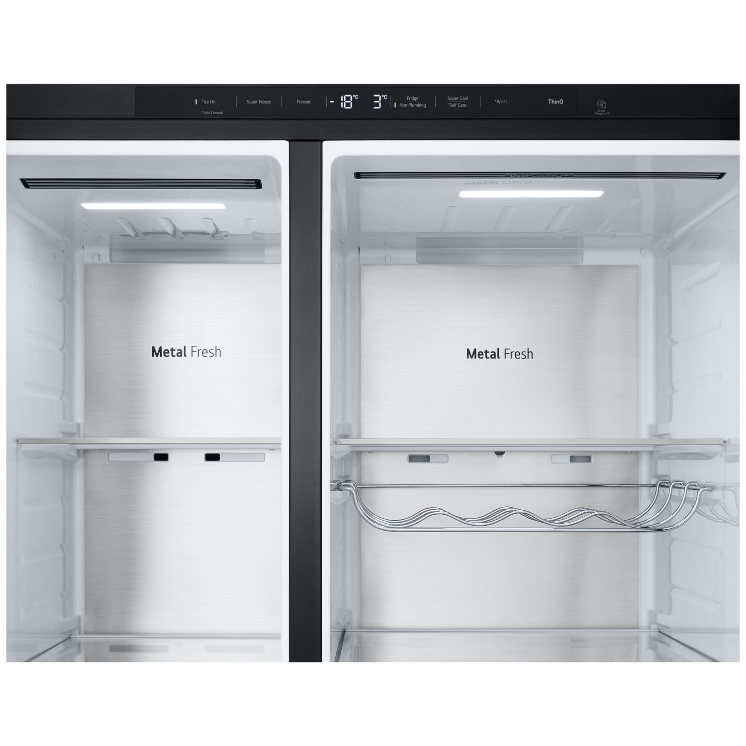 Inside a refrigerator with two compartments. Displays and shelves are visible. Metal Fresh text is on the inside. Temperature and settings are displayed.