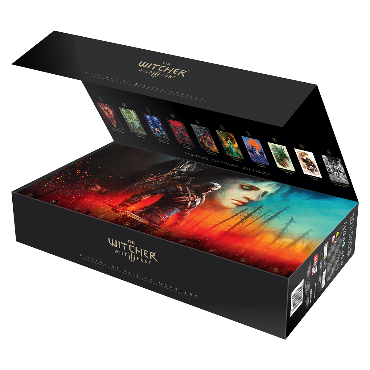 Otwarty czarny box z grafiką Witcher Wild Hunt. Wewnątrz grafiki i duży obraz z wojownikiem i kobietą z ognistym tłem.