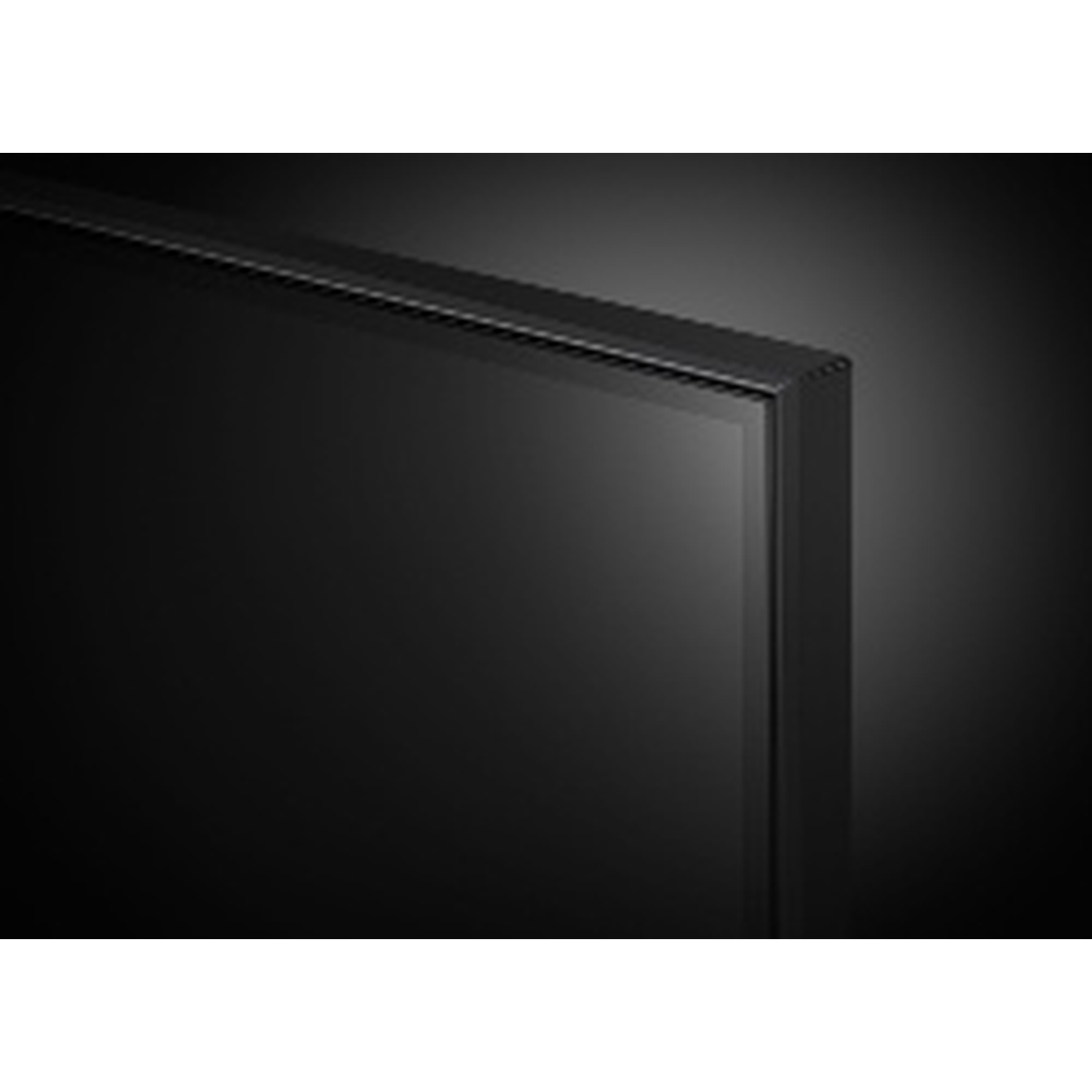 Gros plan sur le coin d'un écran de télévision noir. Le cadre est noir. L'écran est sombre, avec un léger dégradé.