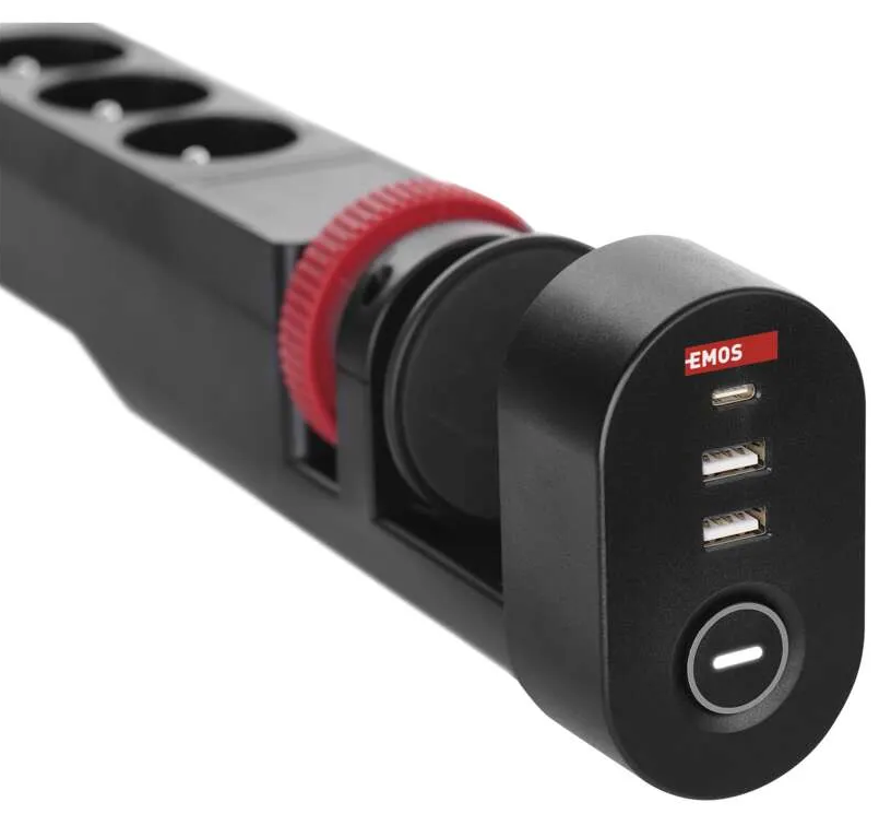 Fekete elosztó piros gyűrűvel és USB portokkal. Az 'EMOS' logó látható. Aljzatokat és egy be/ki gombot tartalmaz.