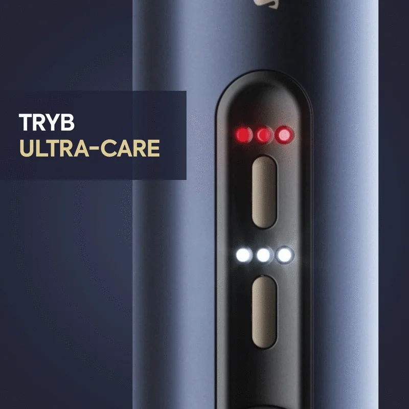 Zbliżenie ciemnego urządzenia. Ma świecące czerwone i białe światła. Tekst 'TRYB ULTRA-CARE' jest po lewej stronie.