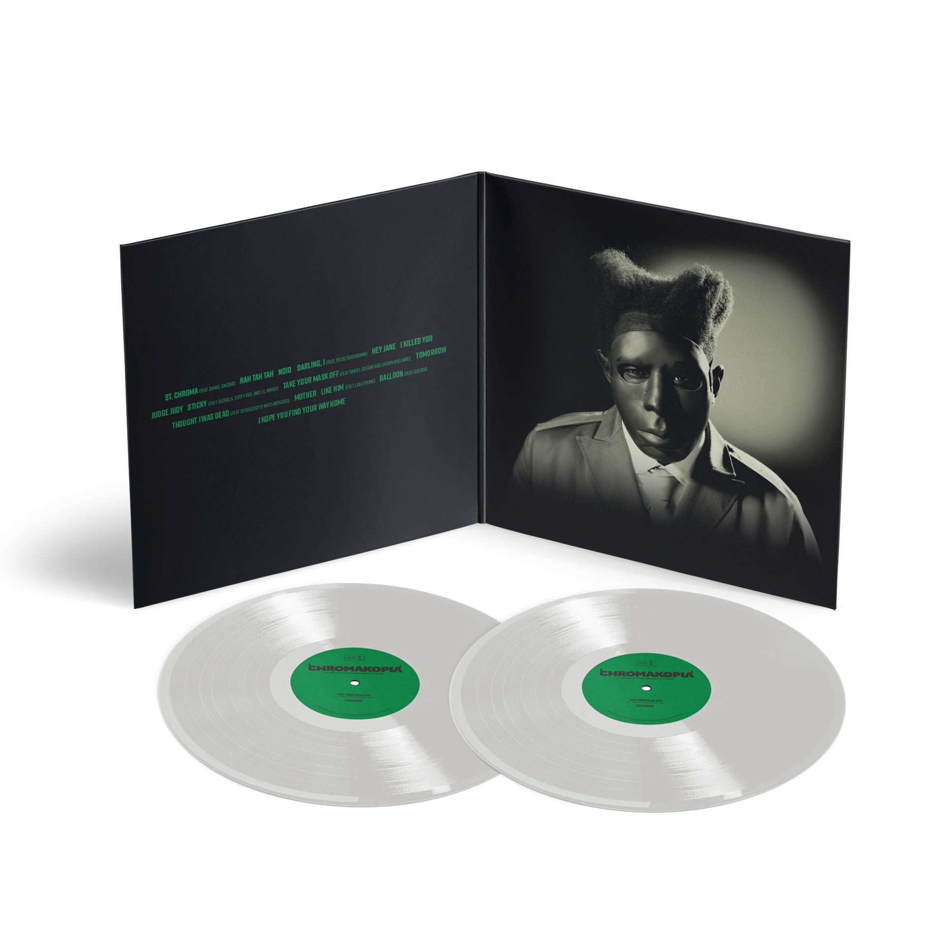 Albumcover: Ein Mann im Anzug mit besonderer Frisur. Zwei Schallplatten unten mit Albumtitel und Songs.