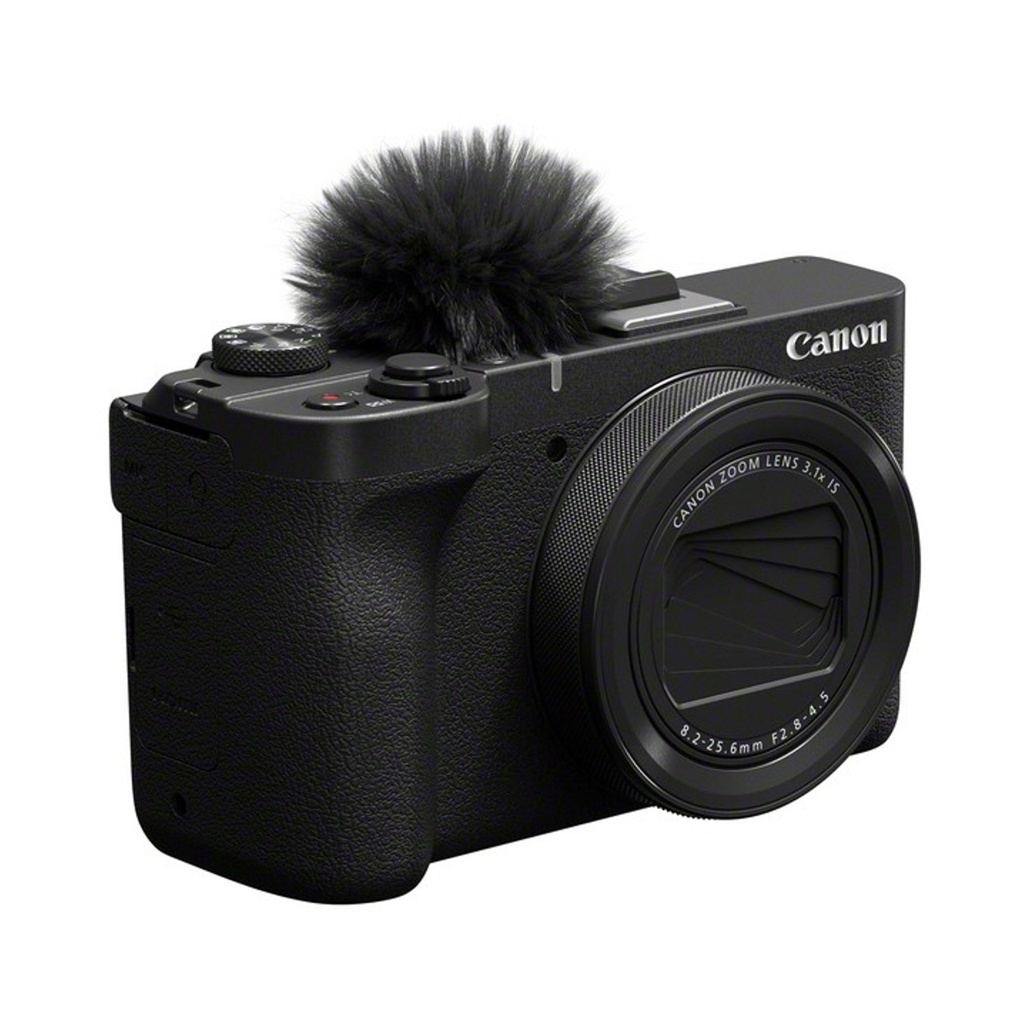 Fotocamera Canon nera con microfono collegato. L'obiettivo è visibile, con testo Canon Zoom Lens. La fotocamera è su sfondo bianco.