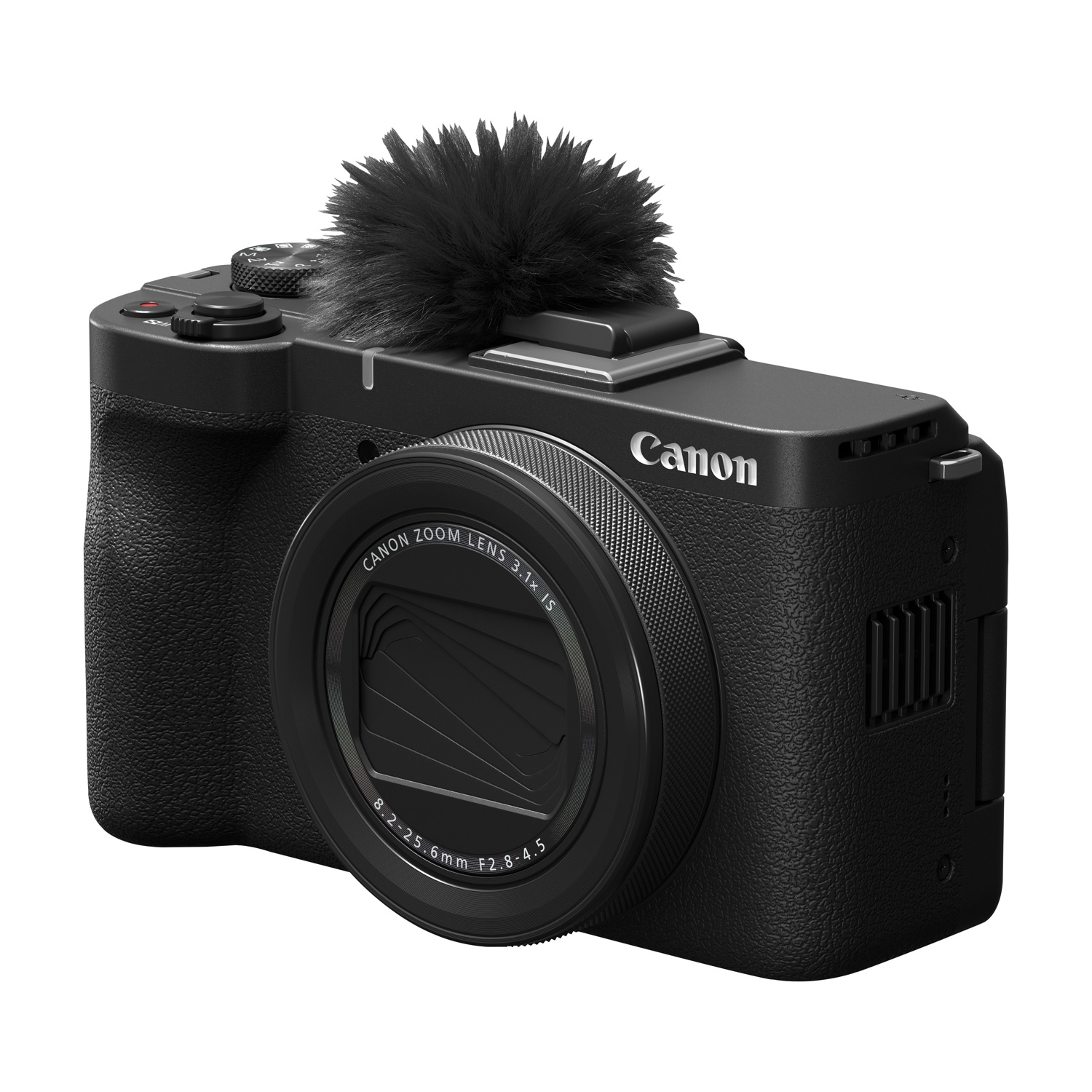 Una fotocamera Canon nera con un microfono peloso sopra. Ha un obiettivo zoom e si trova su sfondo bianco.