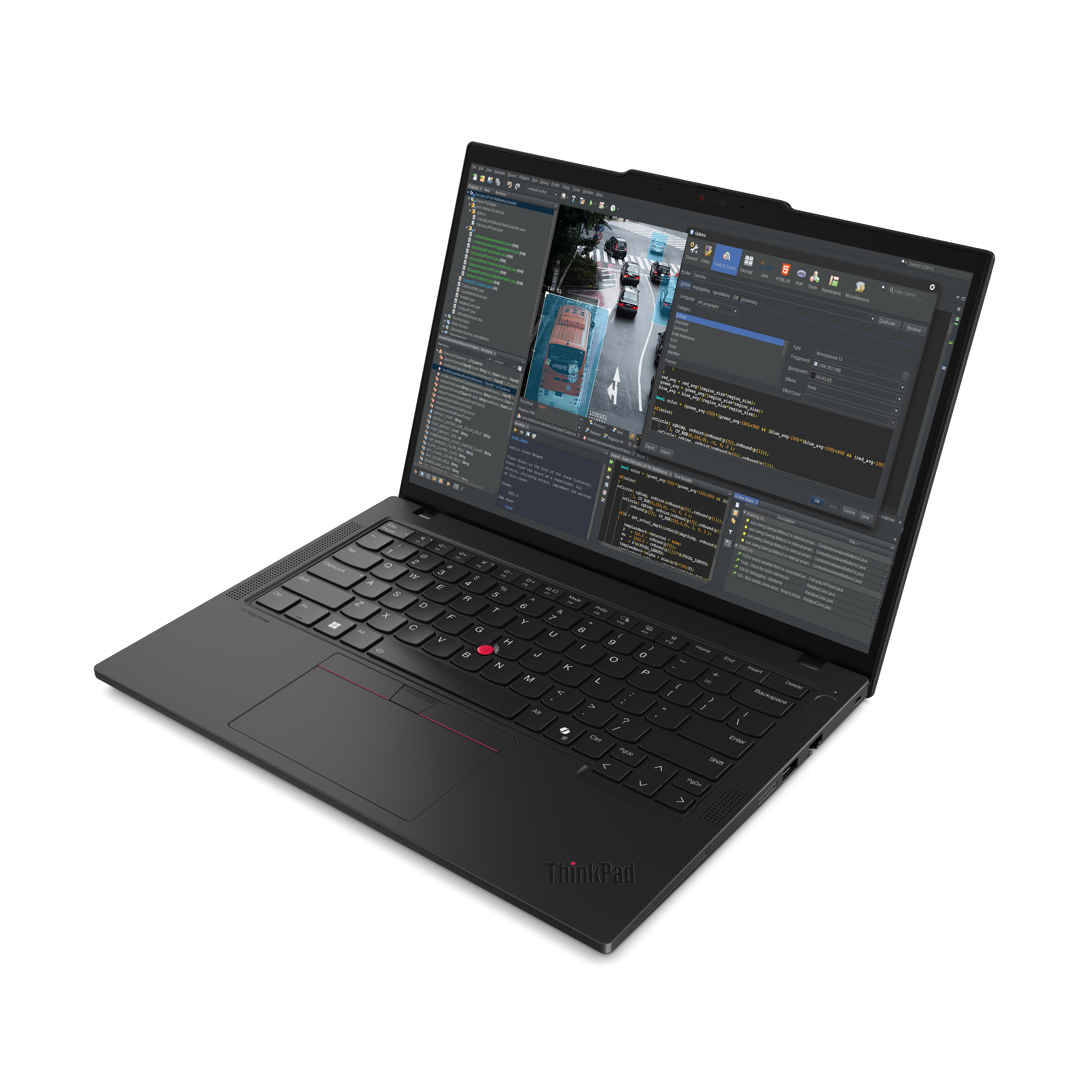 Ein schwarzer ThinkPad-Laptop ist geöffnet und zeigt Code. Der Bildschirm zeigt eine Verkehrsszene.