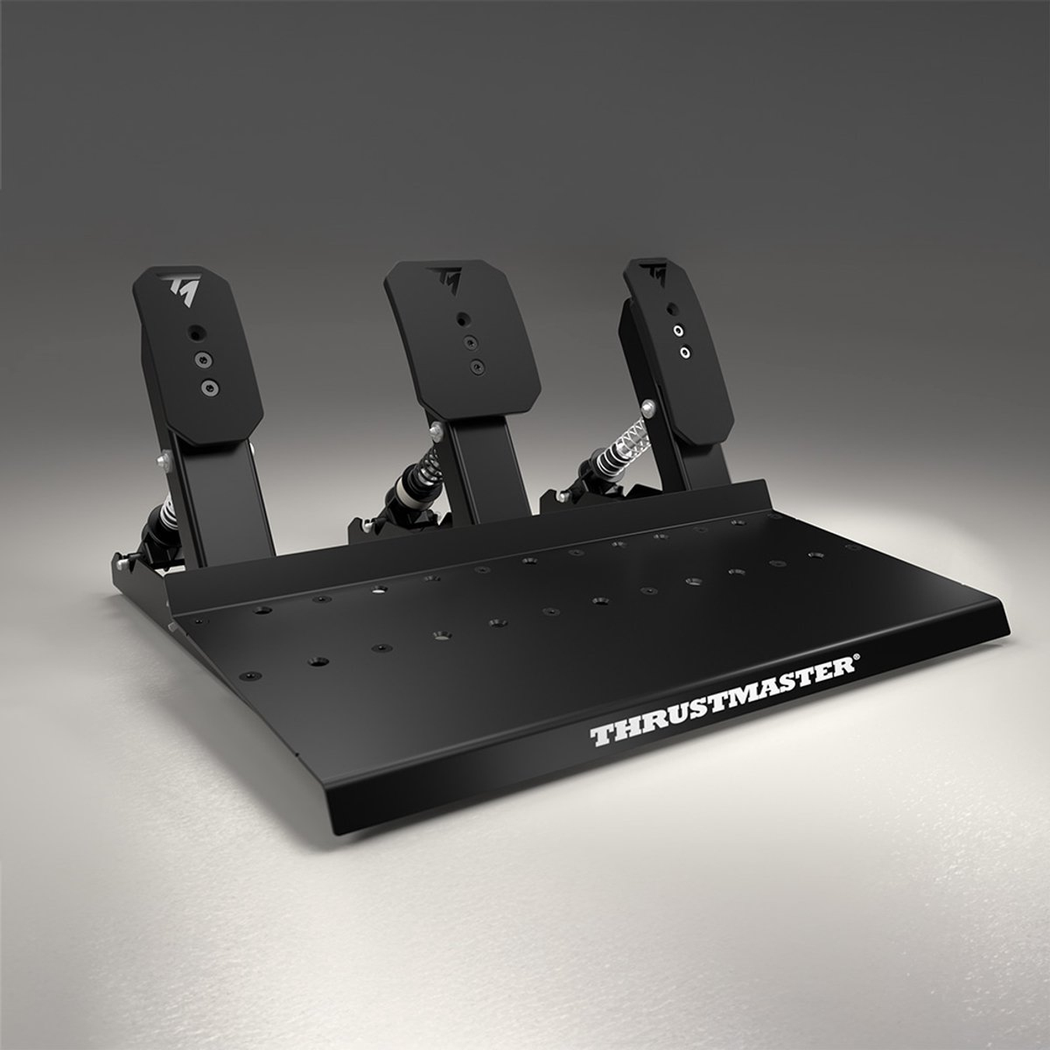 Pédales de course Thrustmaster noires sur une surface claire. Trois pédales avec ressorts et une plaque de base. Logo visible.