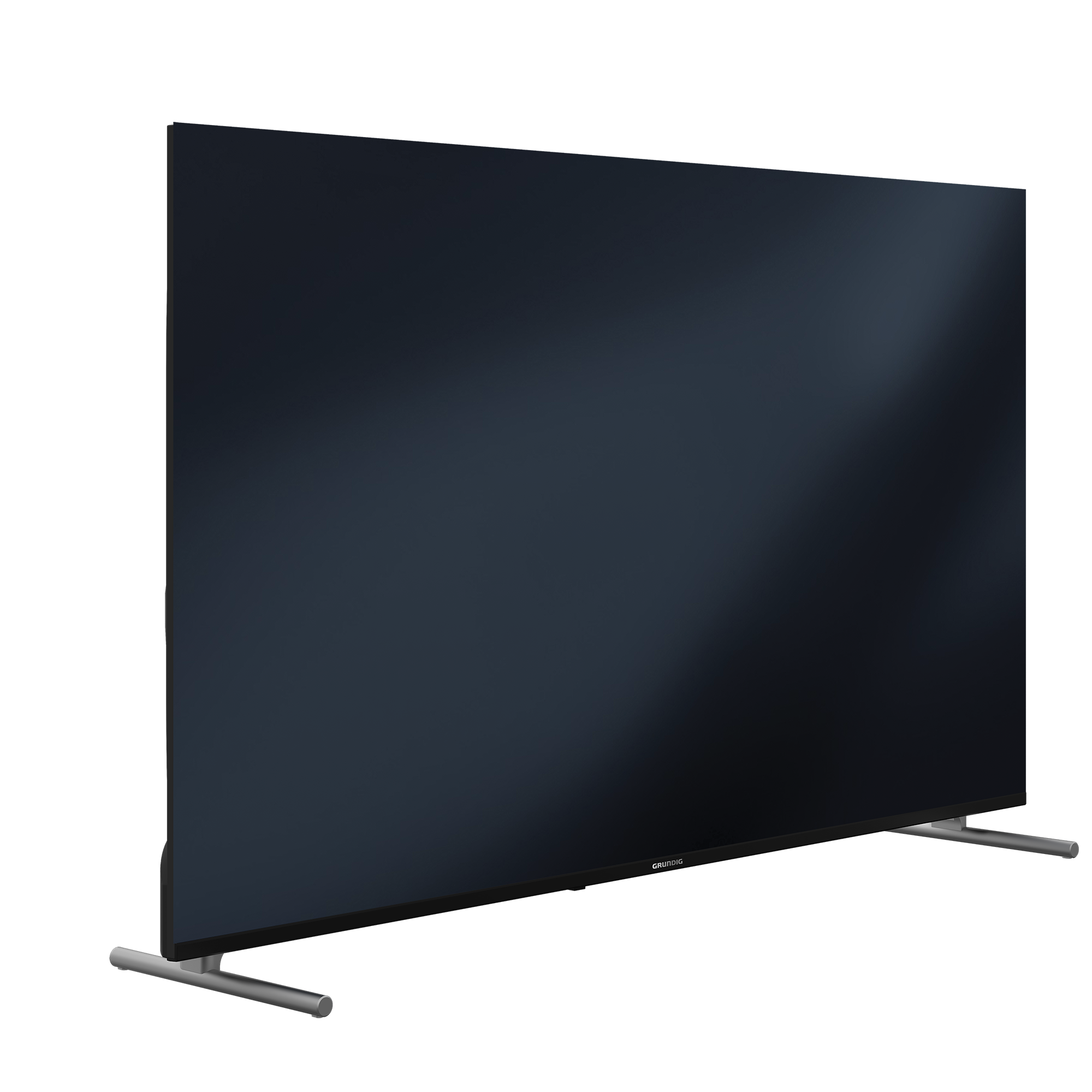 Gümüş ayaklar üzerinde büyük siyah Grundig TV. Ekran karanlık, marka adı altta görülebilir.