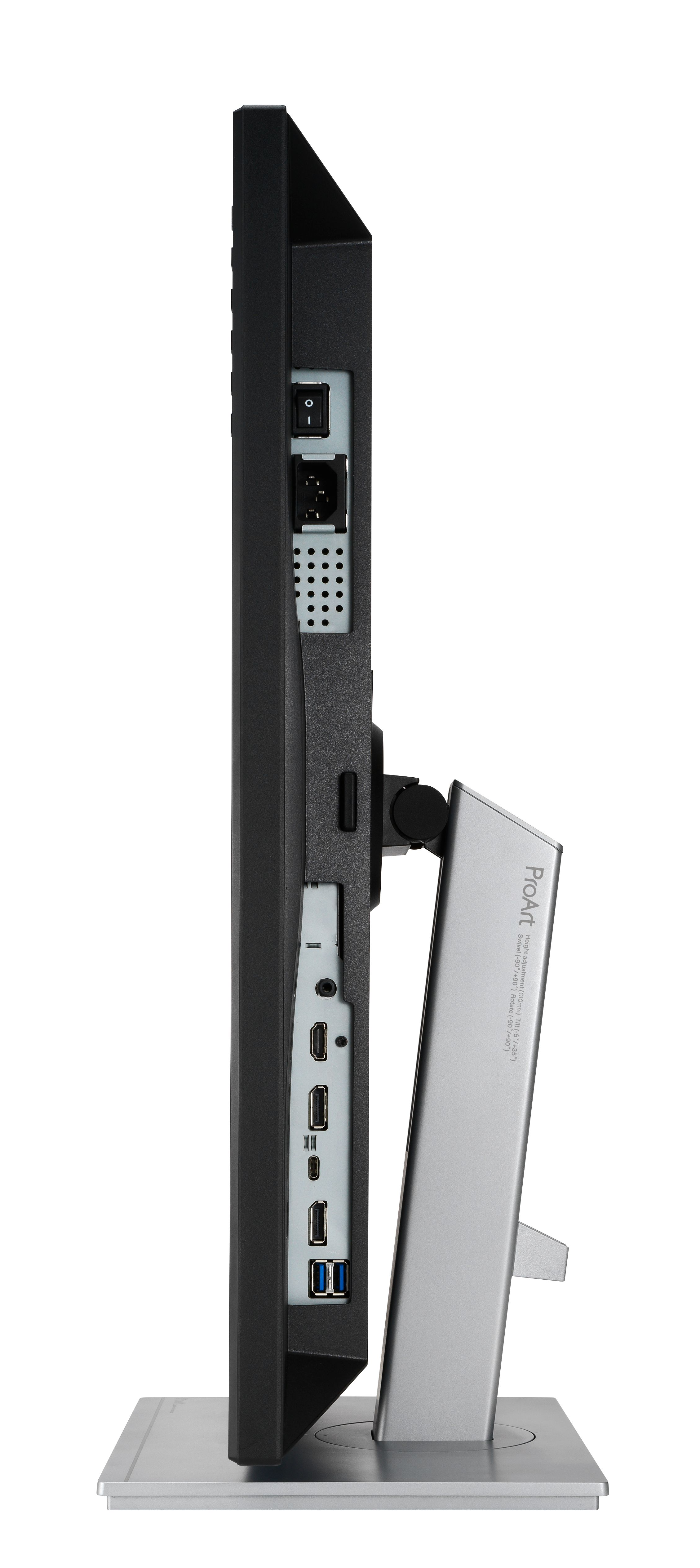 Widok z boku monitora. Czarny ekran, srebrna podstawka. Widoczny przycisk zasilania i porty. Logo i specyfikacje ProArt wydrukowane na podstawce.