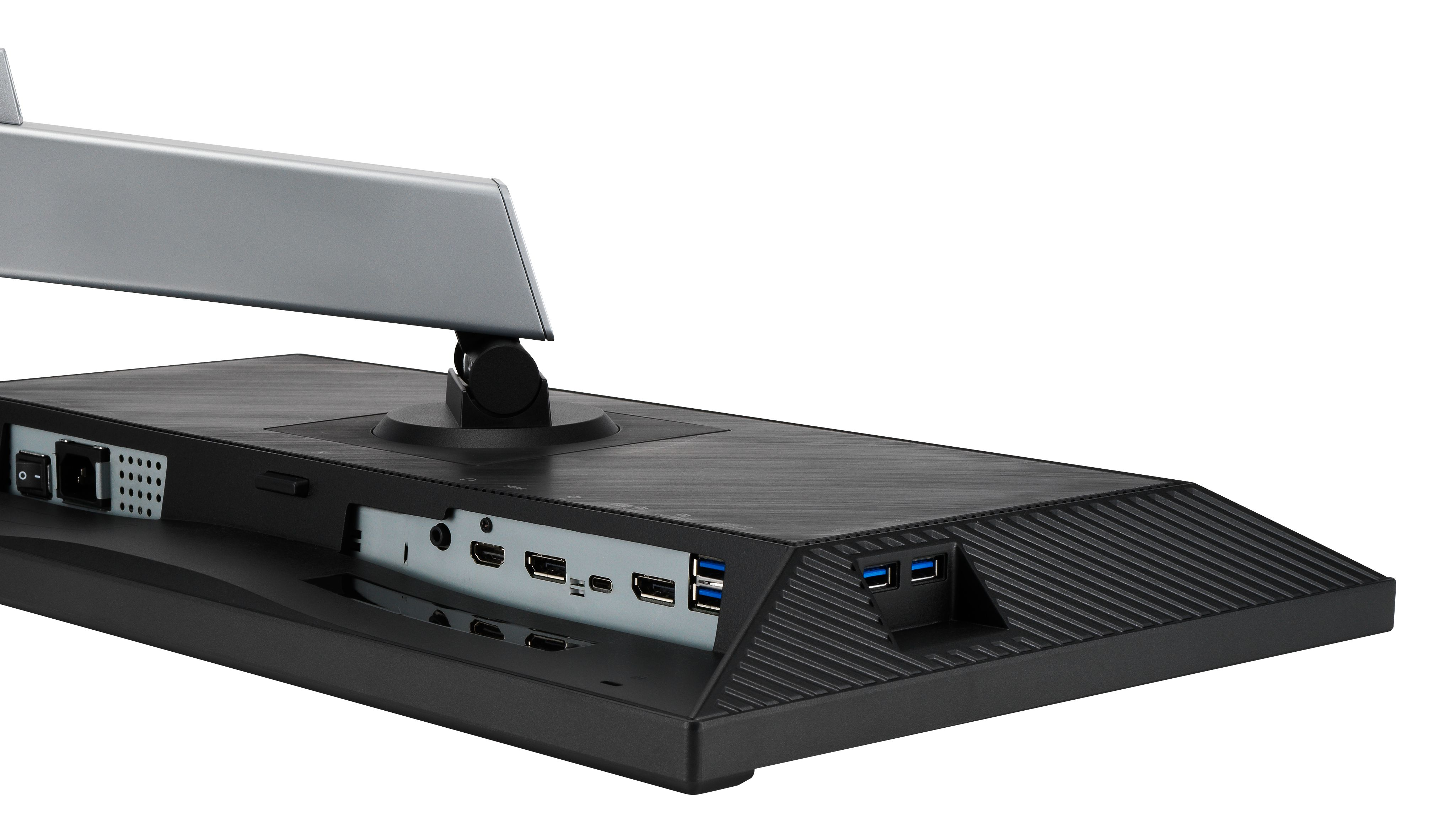 Tył czarnego monitora. Ma srebrną podstawkę i różne porty, w tym USB i HDMI, oraz przycisk zasilania.