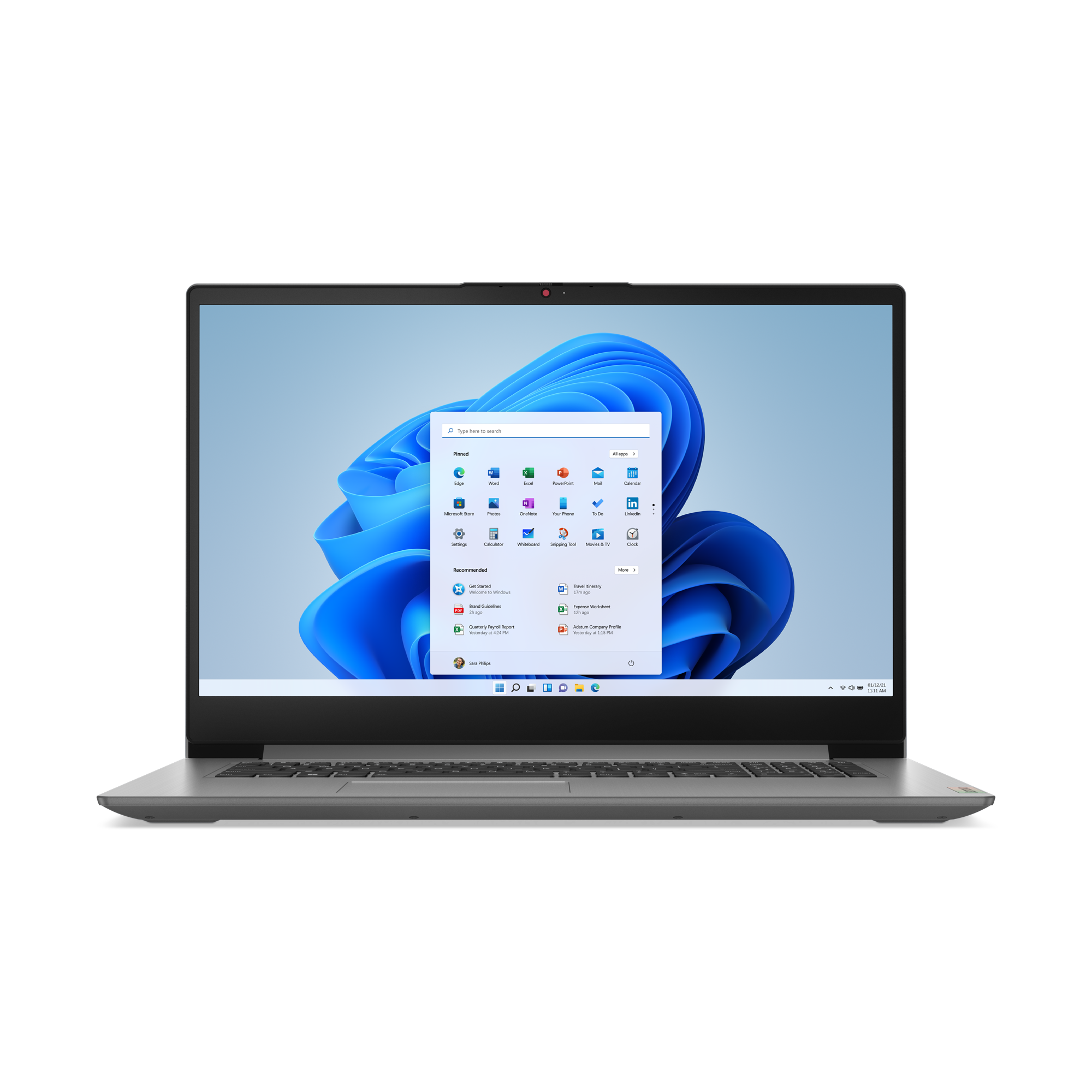 Srebrny laptop wyświetla interfejs Windows 11. Ekran pokazuje menu start z ikonami aplikacji i niebieskim tłem.