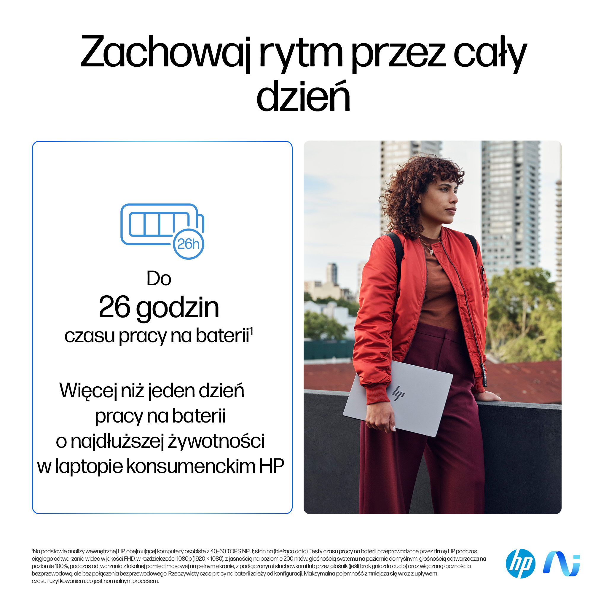 Kobieta w czerwonej kurtce trzyma laptopa. Budynki w tle. Tekst: 26 godzin pracy na baterii.
