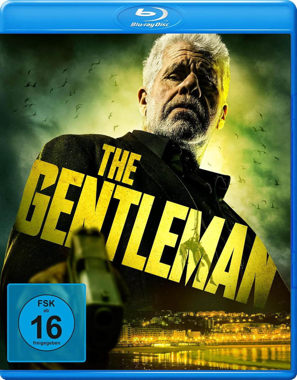 Blu-ray-Cover für 'The Gentleman'. Zeigt einen älteren Mann mit einer Waffe, Titeltext und eine Stadt bei Nacht.