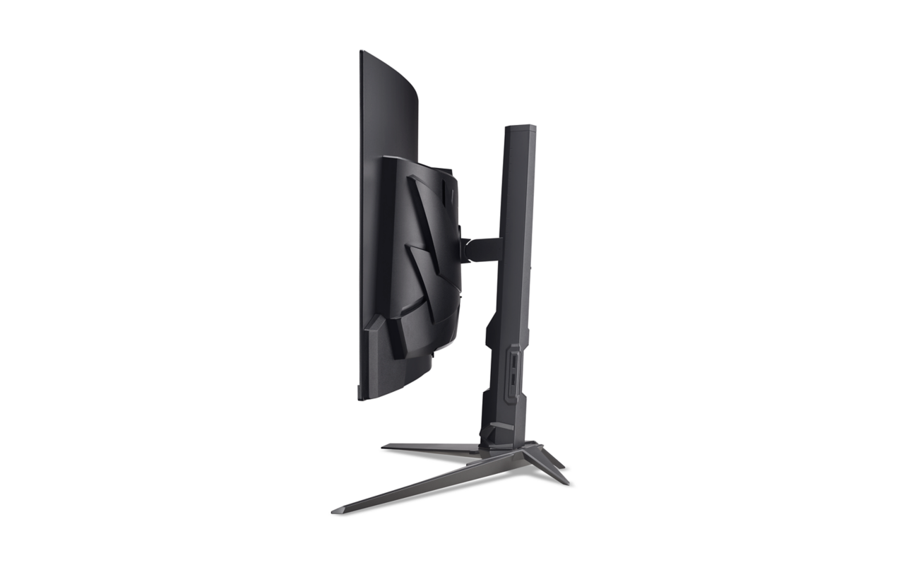 Egy ívelt fekete számítógép-monitor oldalsó nézete állvánnyal fehér háttér előtt.