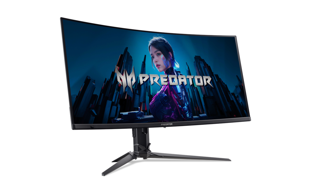 Ívelt Predator gamer monitor. Futurisztikus jelenetet jelenít meg egy nővel. Fekete állvány és keret fehér háttéren.