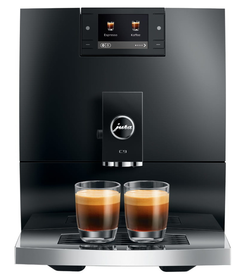 Czarny ekspres do kawy Jura z dwiema szklankami kawy. Maszyna posiada cyfrowy wyświetlacz i logo Jura.