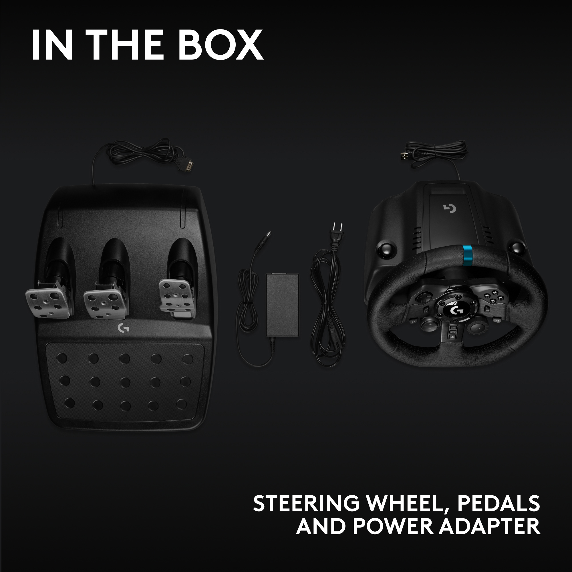 L'image montre un volant, des pédales et un adaptateur secteur sur fond noir. Le texte indique 'In the Box'.