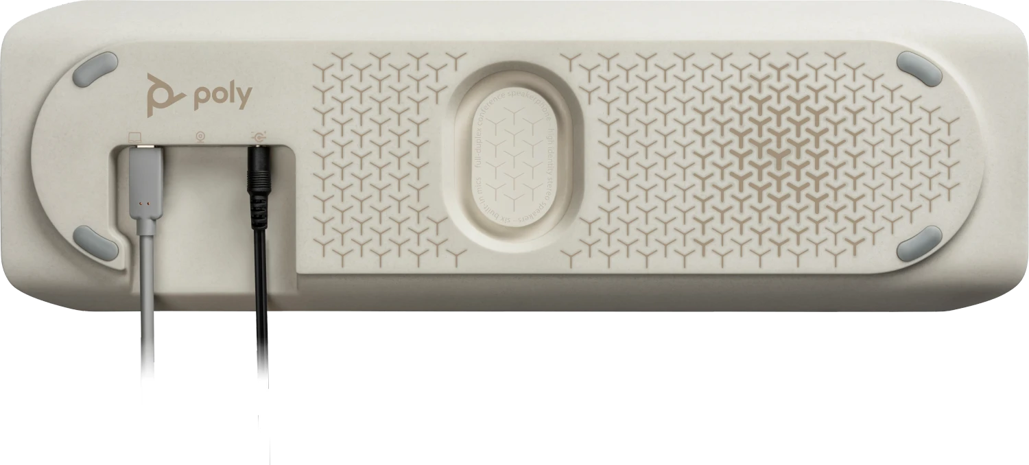 Ein beigefarbenes Freisprechtelefon mit gemusterter Oberfläche, dem Poly-Logo und angeschlossenen Kabeln. Mit Tasten und Eingangsanschlüssen.