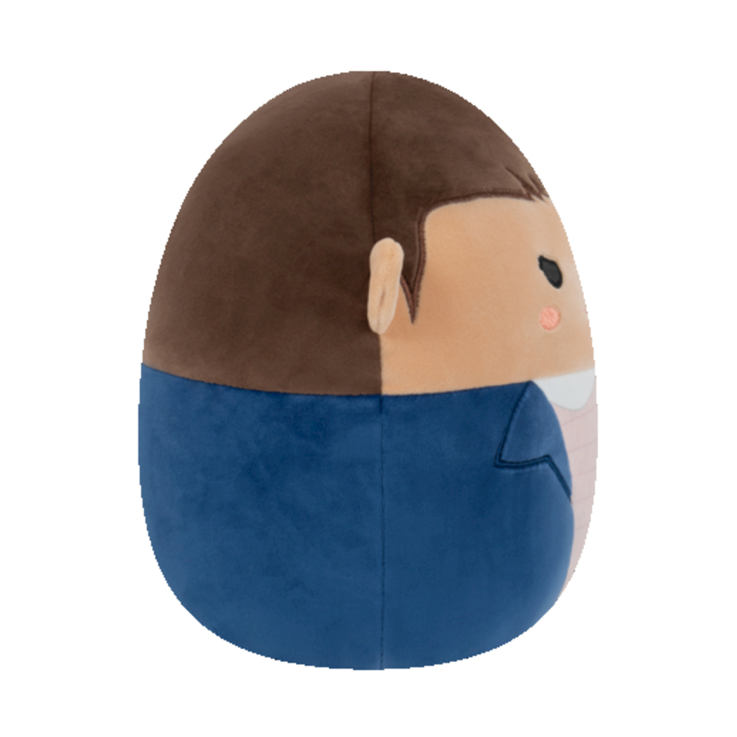 Un peluche a forma di un personaggio di Stranger Things. Ha i capelli castani, una giacca blu e una camicia rosa chiaro.