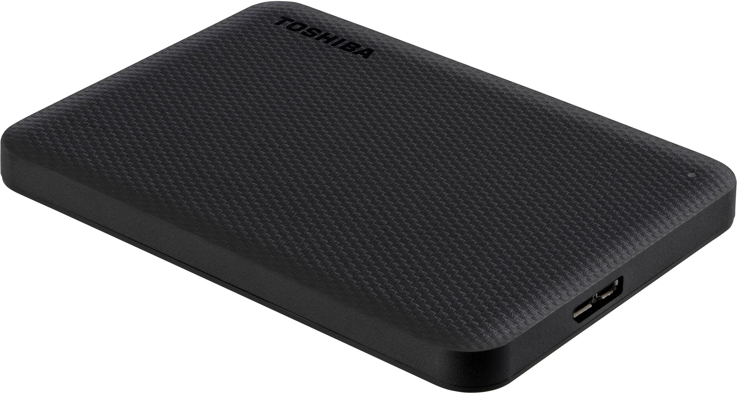 Un disque dur externe Toshiba noir, surface texturée, avec la marque visible. L'appareil dispose de ports USB.