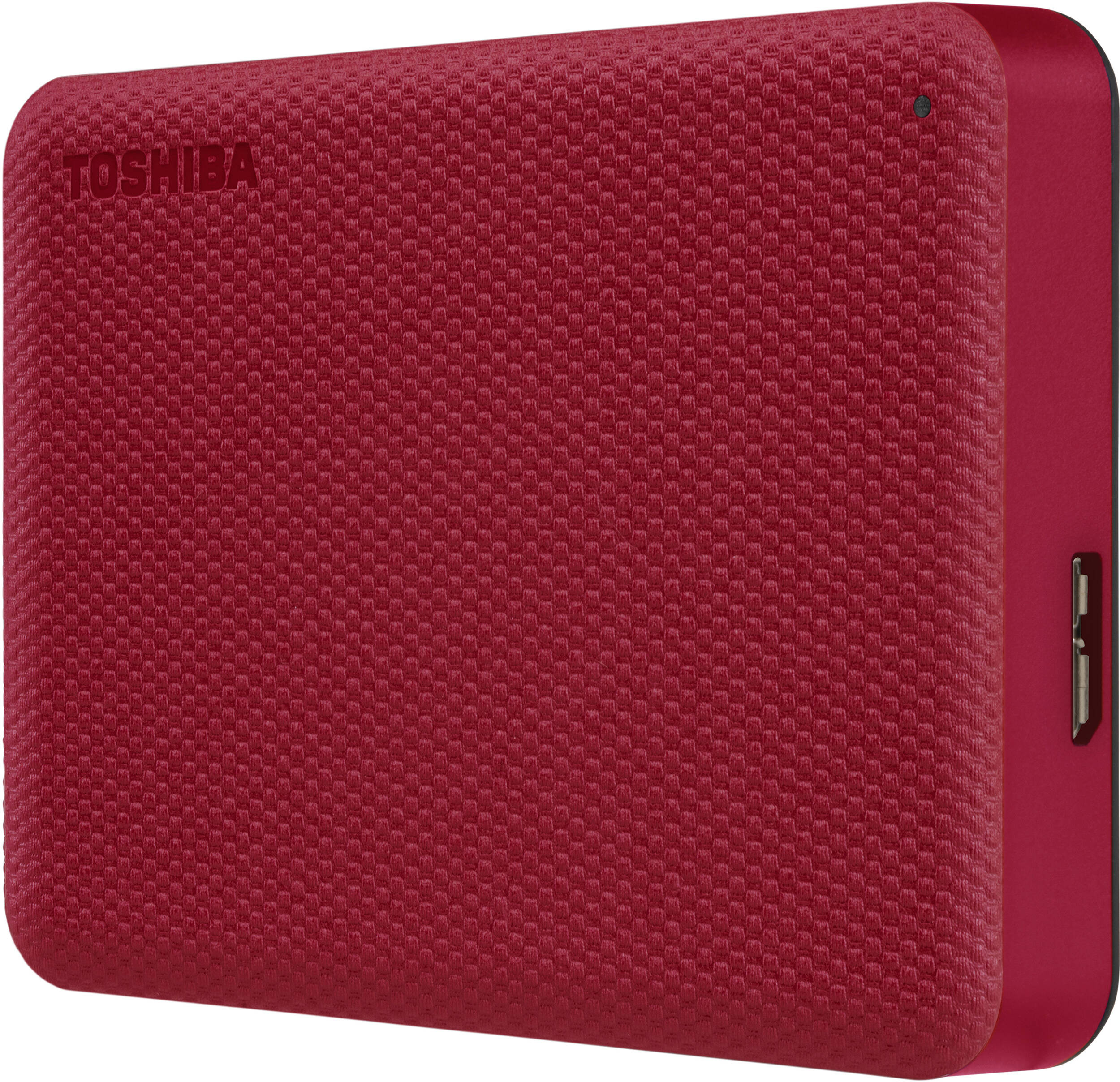 Un disque dur externe rouge Toshiba. La face avant est texturée avec le nom de la marque. Le côté est lisse et rouge.
