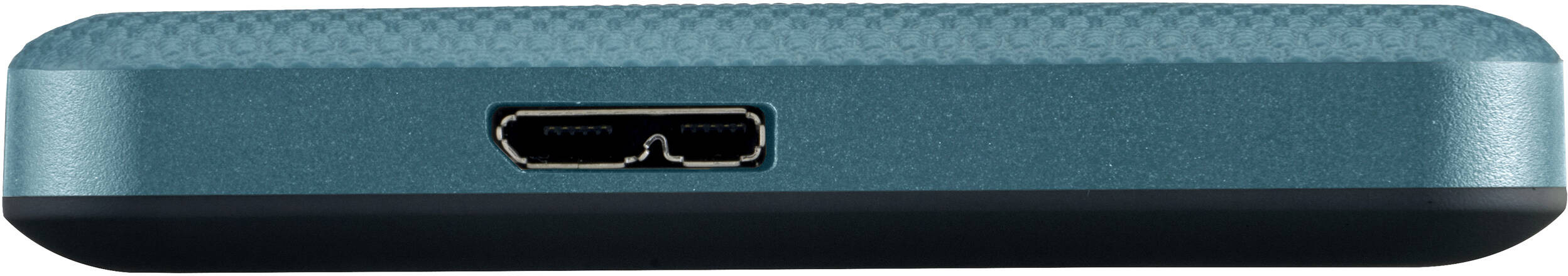 Gros plan d'un appareil bleu-vert avec un port USB. Il a une surface texturée et un bord inférieur noir.