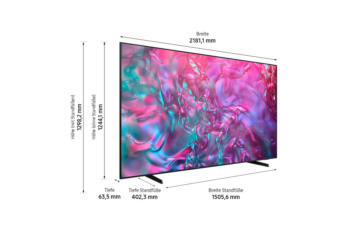 Großer Fernseher mit Abmessungen. Höhe mit Ständer: 1298,2 mm, ohne Ständer: 1244,1 mm. Breite: 2181,1 mm. Tiefe: 63,5 mm, Ständertiefe: 402,3 mm, Ständerbreite: 1505,6 mm.