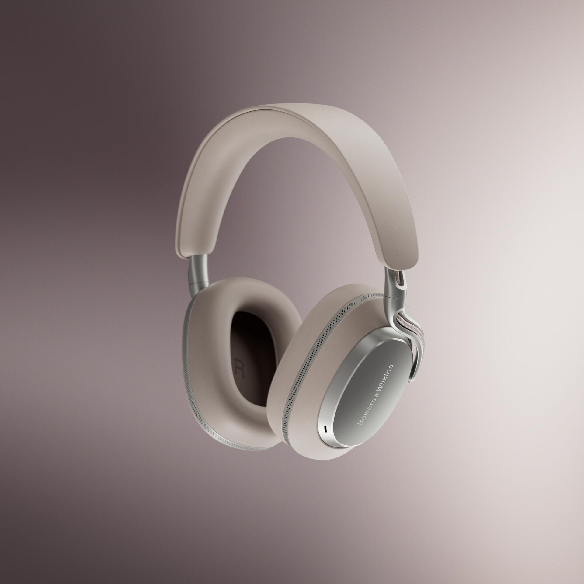 Beige Kopfhörer mit silbernen Akzenten und Bowers & Wilkins-Logo auf Farbverlauf Hintergrund.