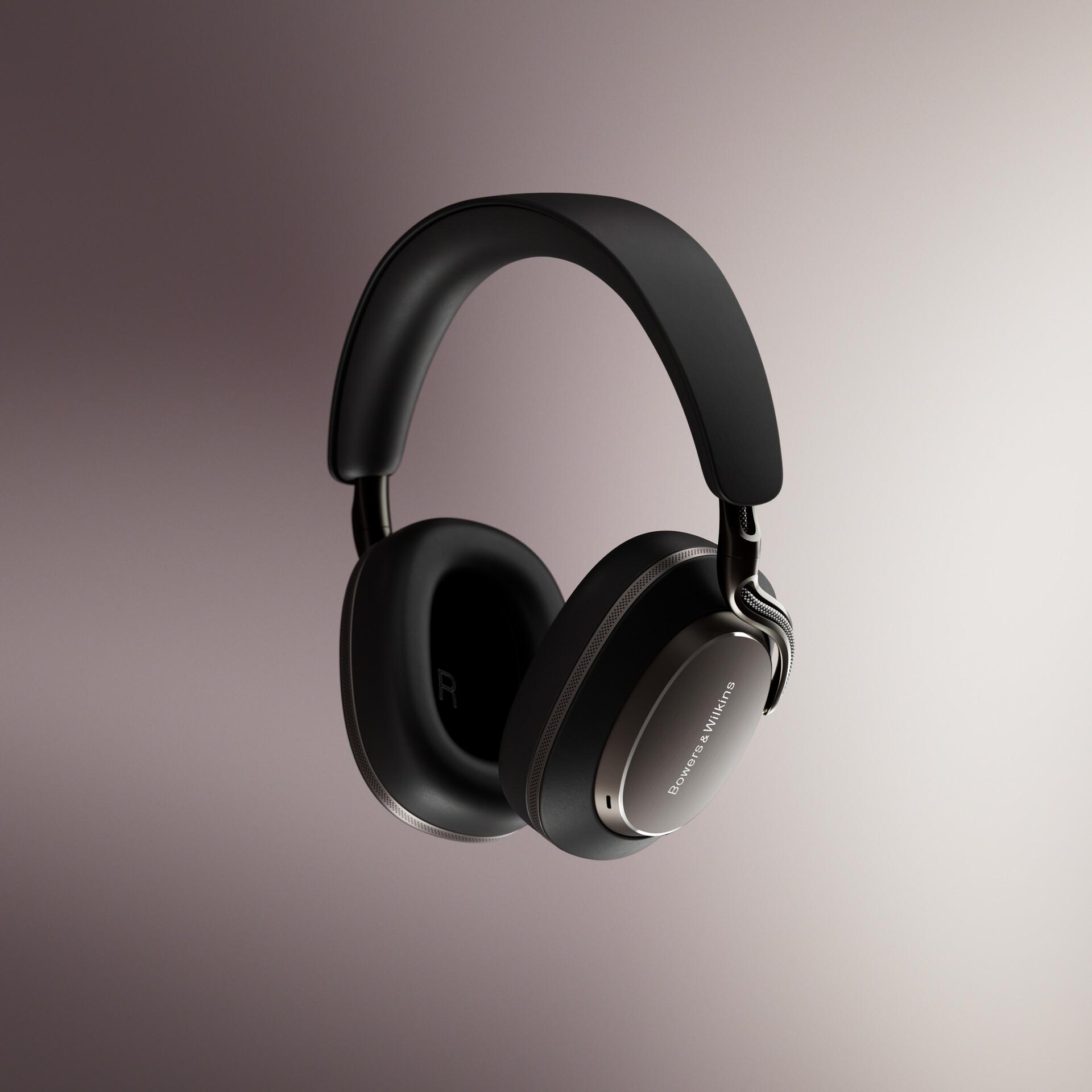 Schwarze Kopfhörer mit silbernen Akzenten. Die Marke Bowers & Wilkins ist sichtbar. Der Hintergrund ist ein Grauverlauf.