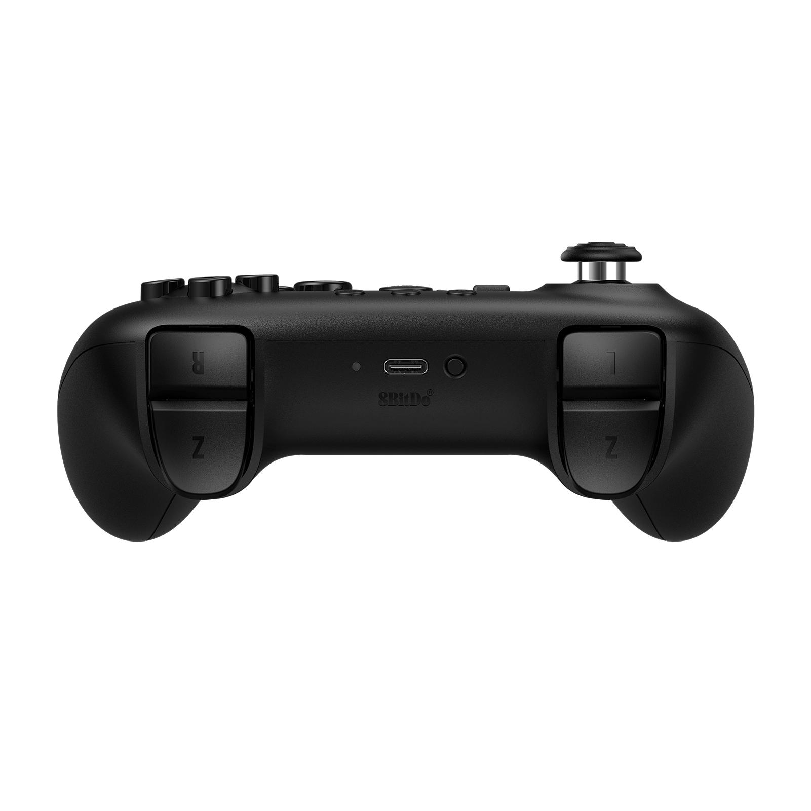 Schwarzer Gamecontroller, von hinten betrachtet. Knöpfe, Auslöser und ein Joystick sind sichtbar.