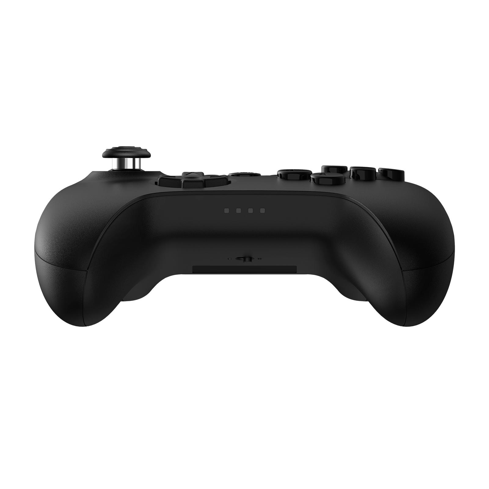 Ein schwarzes Gamepad mit Knöpfen und einem Joystick ist auf weißem Hintergrund zentriert.
