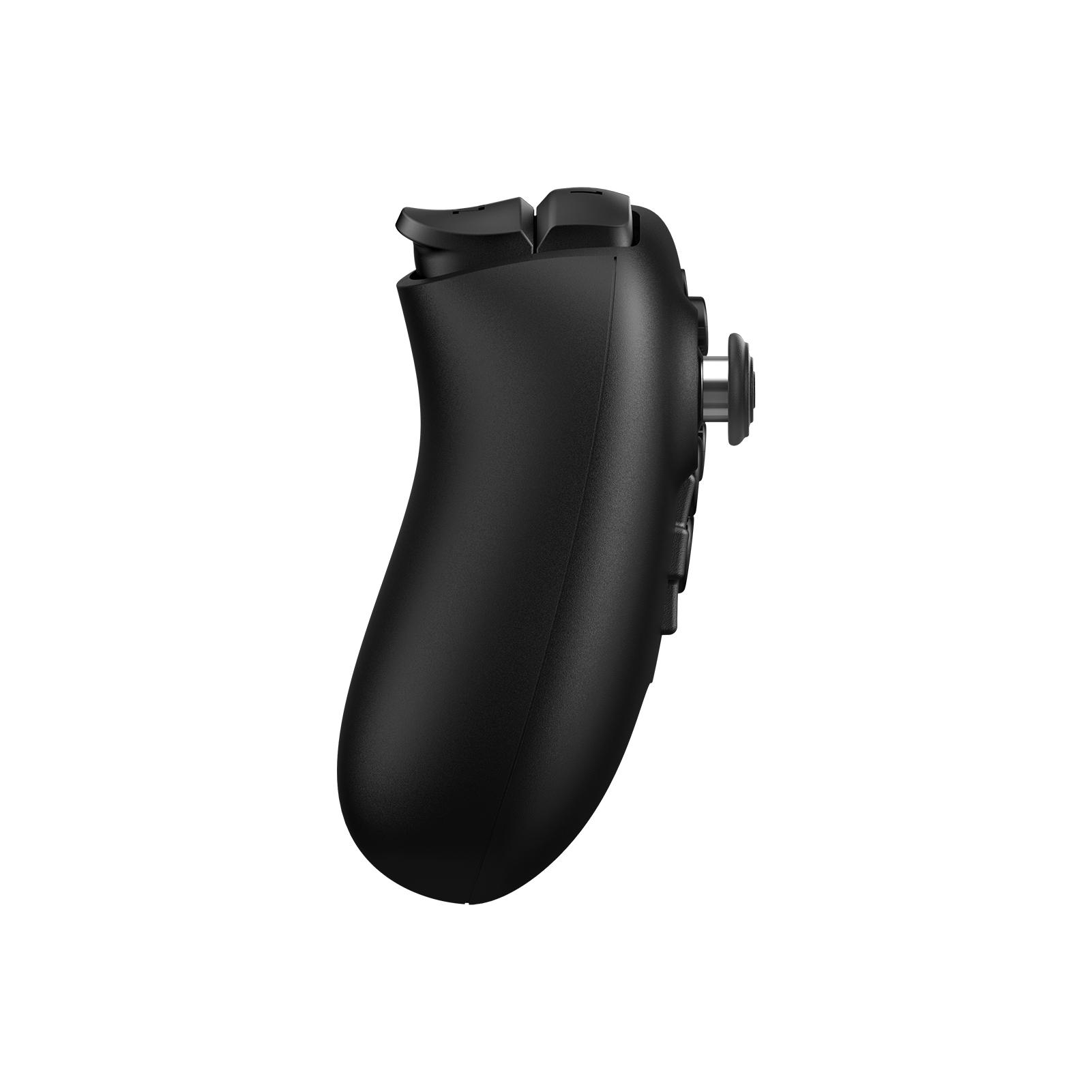 Schwarzer Gamecontroller, Seitenansicht, auf weißem Hintergrund. Tasten und Joystick sichtbar. Kurviges Design.