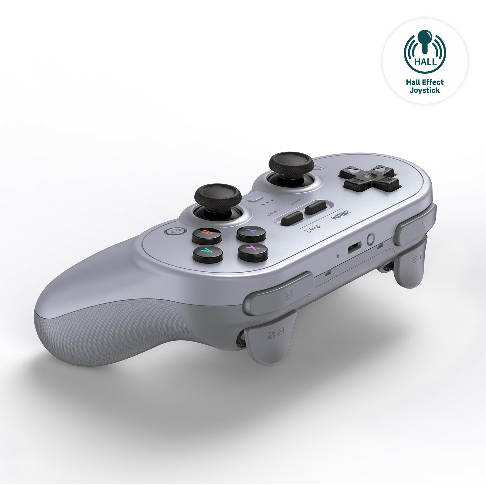 Ein silberner Gamecontroller. Er hat zwei Joysticks, Knöpfe und Auslöser. Ein Logo oben rechts sagt 'Hall Effect Joystick'.