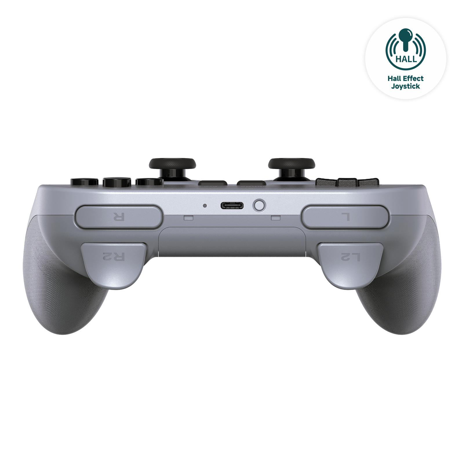 Ein silberner Gamecontroller. Es hat schwarze Knöpfe und Auslöser. Die rechte Seite hat ein Hall-Effect-Joystick-Abzeichen.
