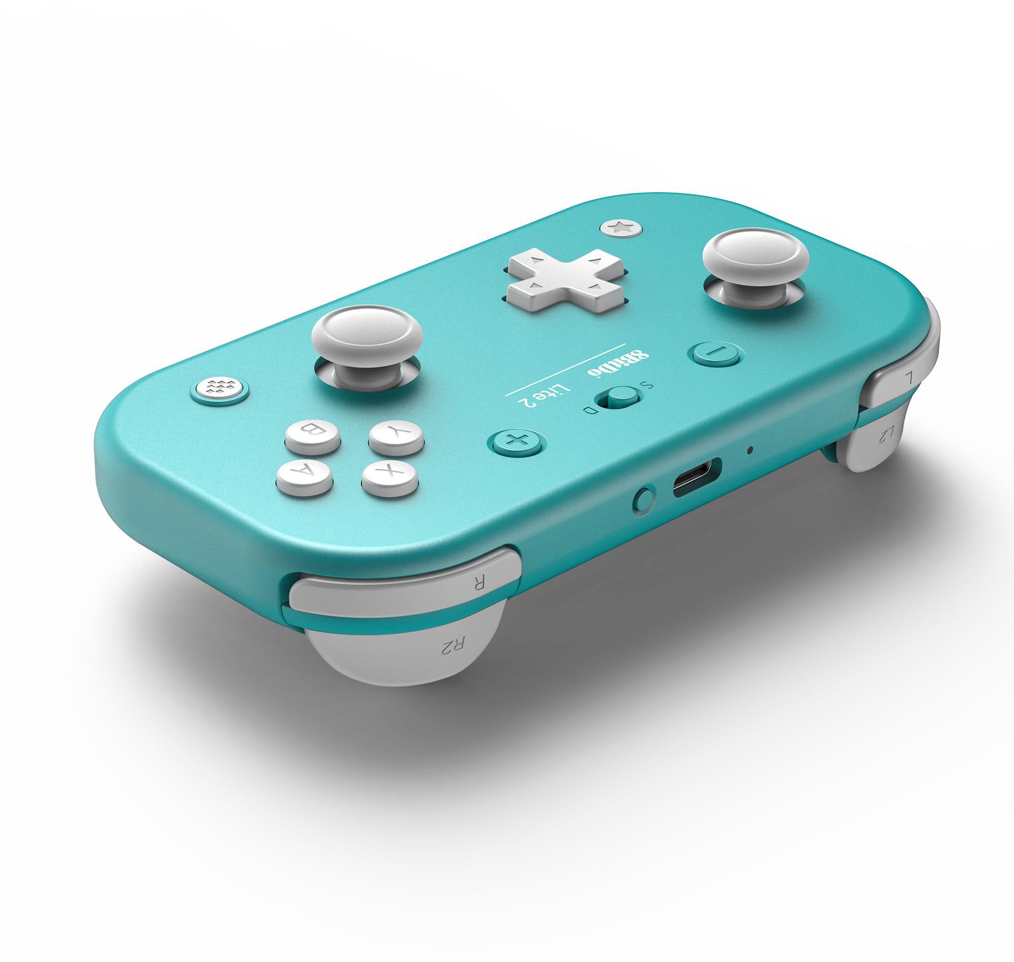 Ein türkisfarbenes Gamepad mit weißen Knöpfen und Joysticks. Es hat ein kreuzförmiges Steuerkreuz und einen Markennamen.