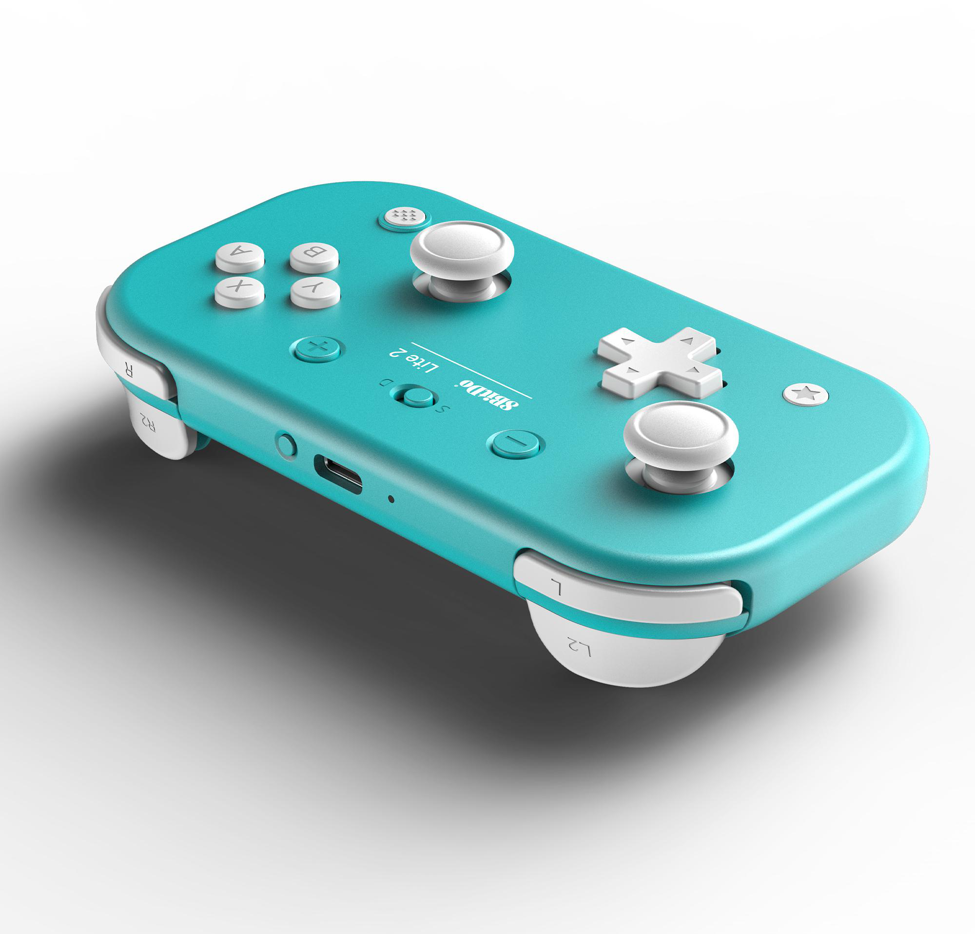 Ein türkisfarbener Spielcontroller mit weißen Knöpfen. Er hat Tasten mit den Bezeichnungen A, B, X, Y, ein Steuerkreuz und zwei Joysticks. Der Hintergrund ist weiß.