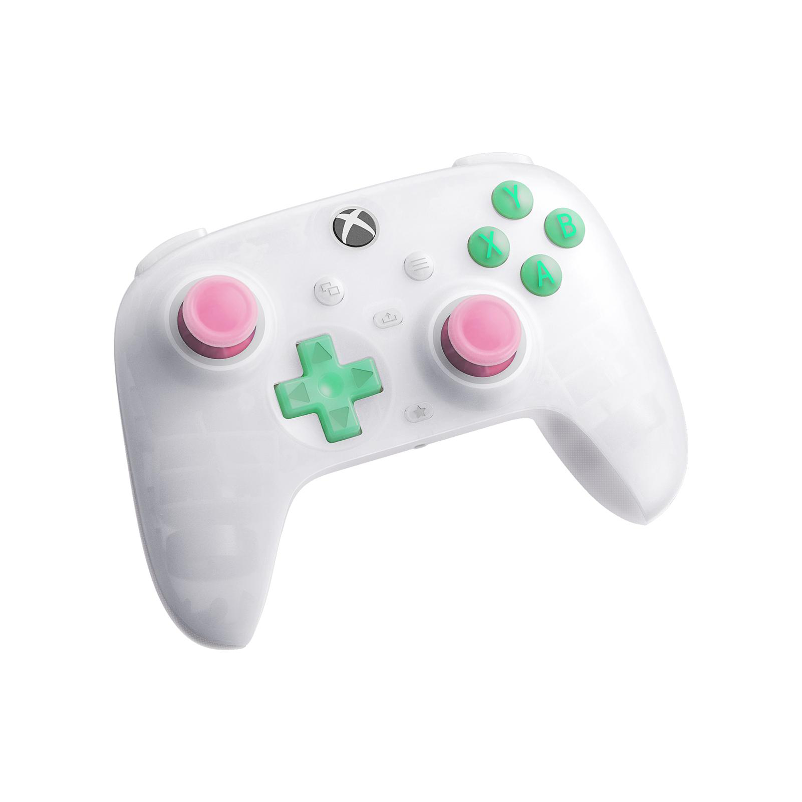 Weißer Xbox-Controller mit rosa Thumbsticks und grünen Tasten auf weißem Hintergrund.